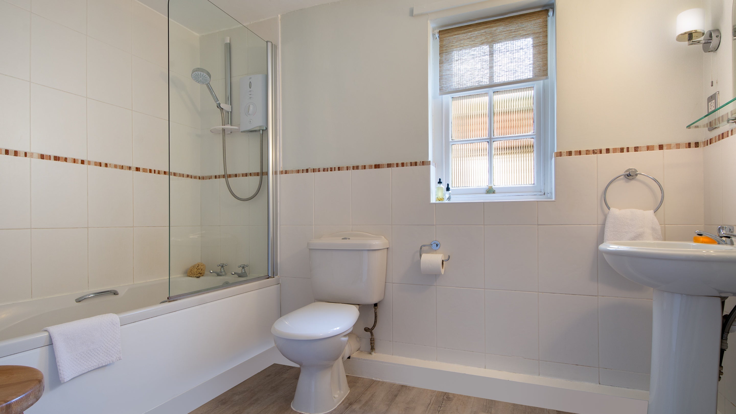 The bathroom with shower over bath at Ravenscar Chapel Cottage, North Yorkshire