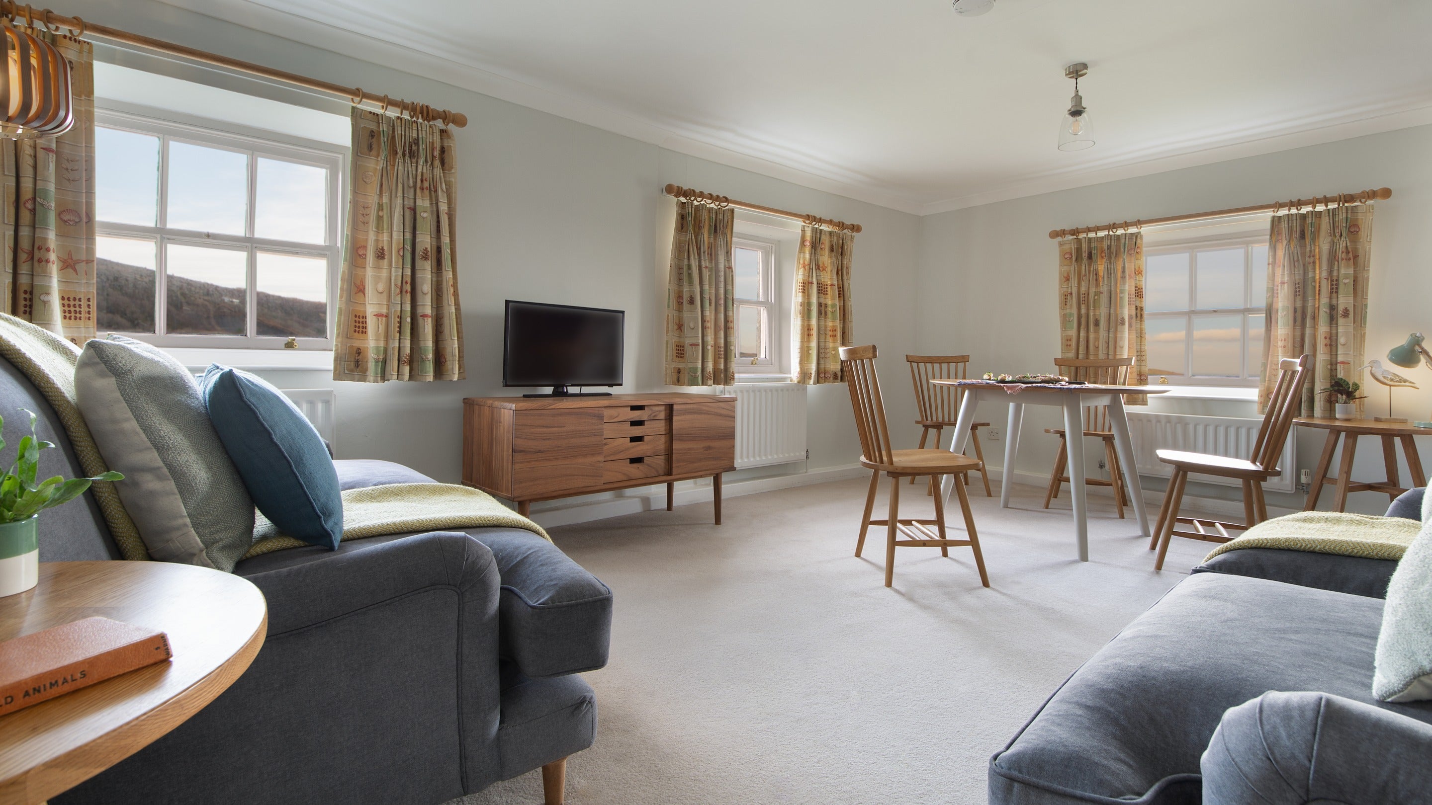 The open-plan sitting and dining room at Ravenscar Chapel Cottage, North Yorkshire