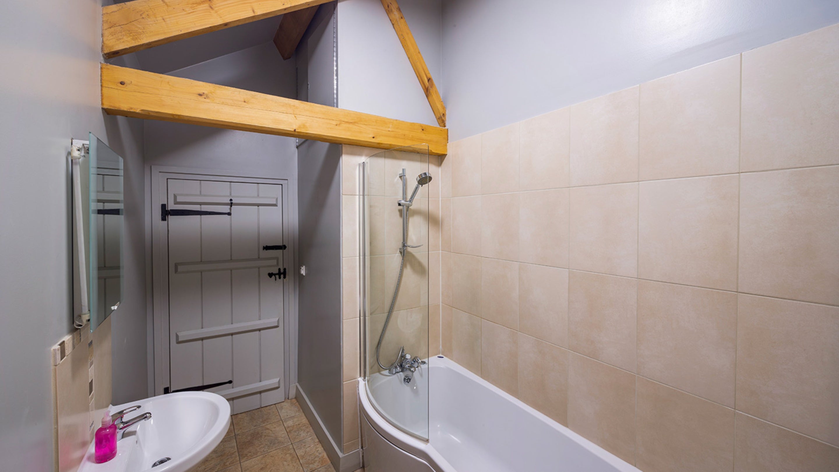 The bathroom with shower over bath at Swallow, Yorkshire