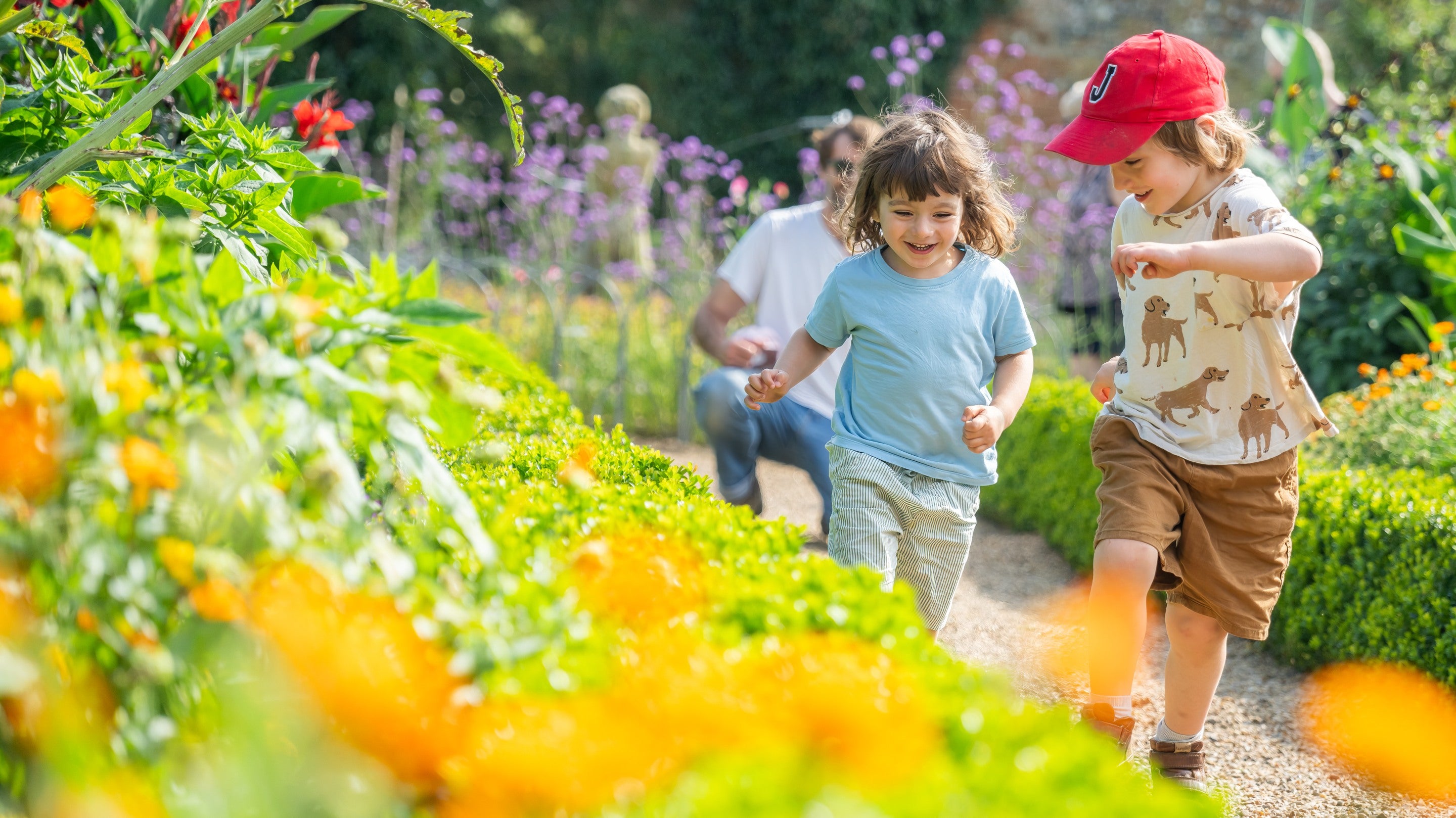 Children playing in the Walled Garden in August at Felbrigg Hall, Norfolk