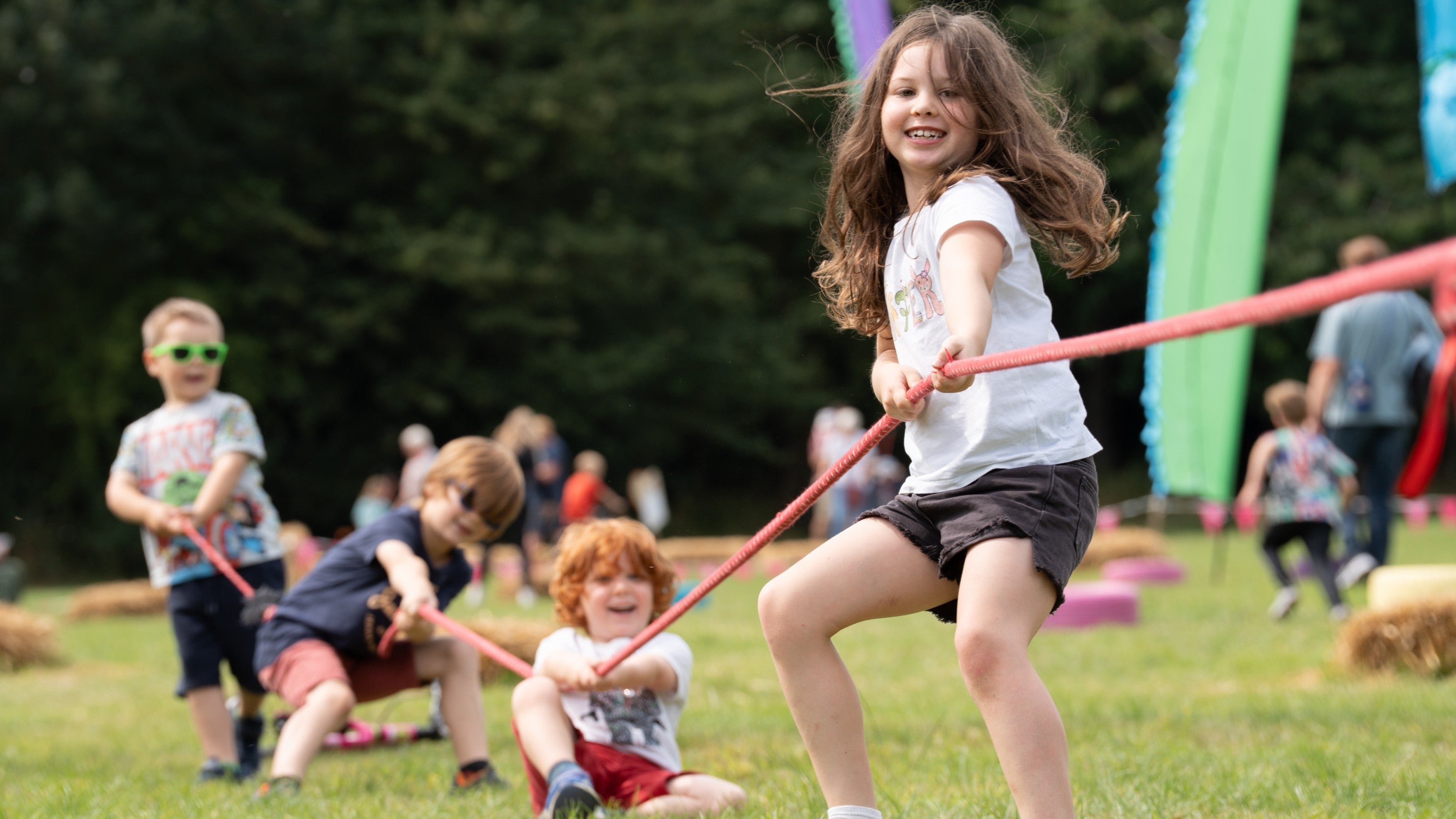 Children taking part in Tug of War during Summer of Play at Fountains Abbey, Yorkshire