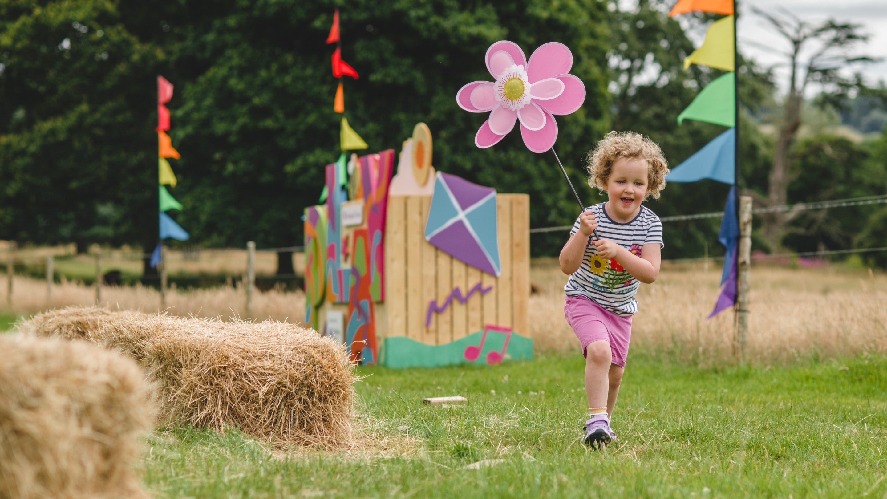 Child enjoying the Summer of Play event at Killerton, Devon