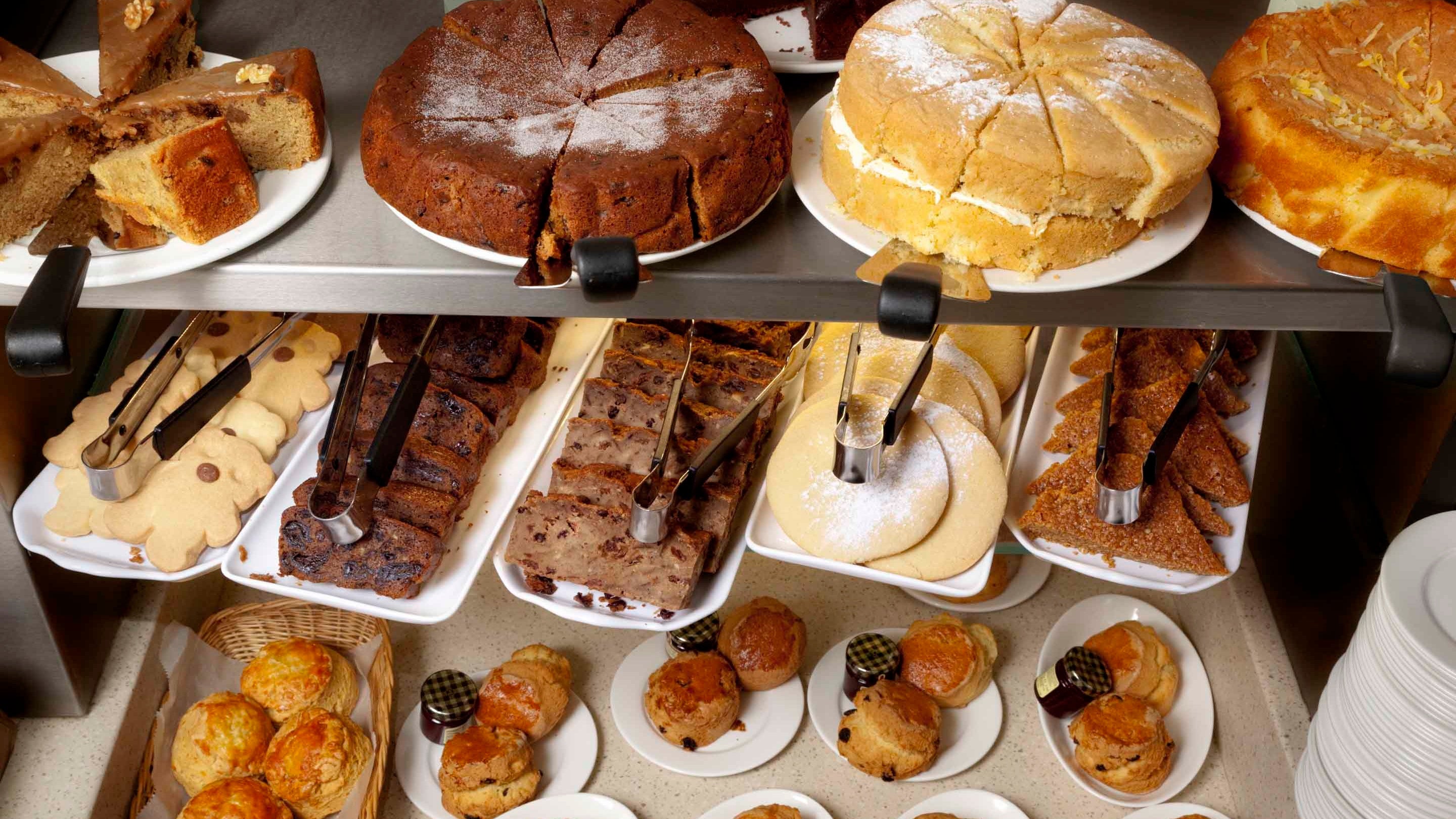 Cake, biscuits and scones in the display unit in the tea-room