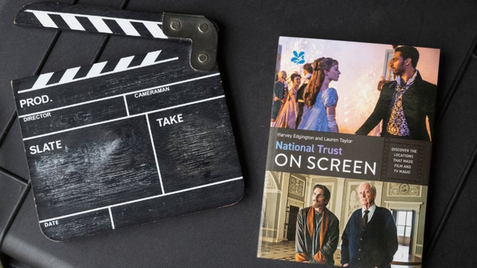 'National Trust on screen' book next to a blank film clapper board