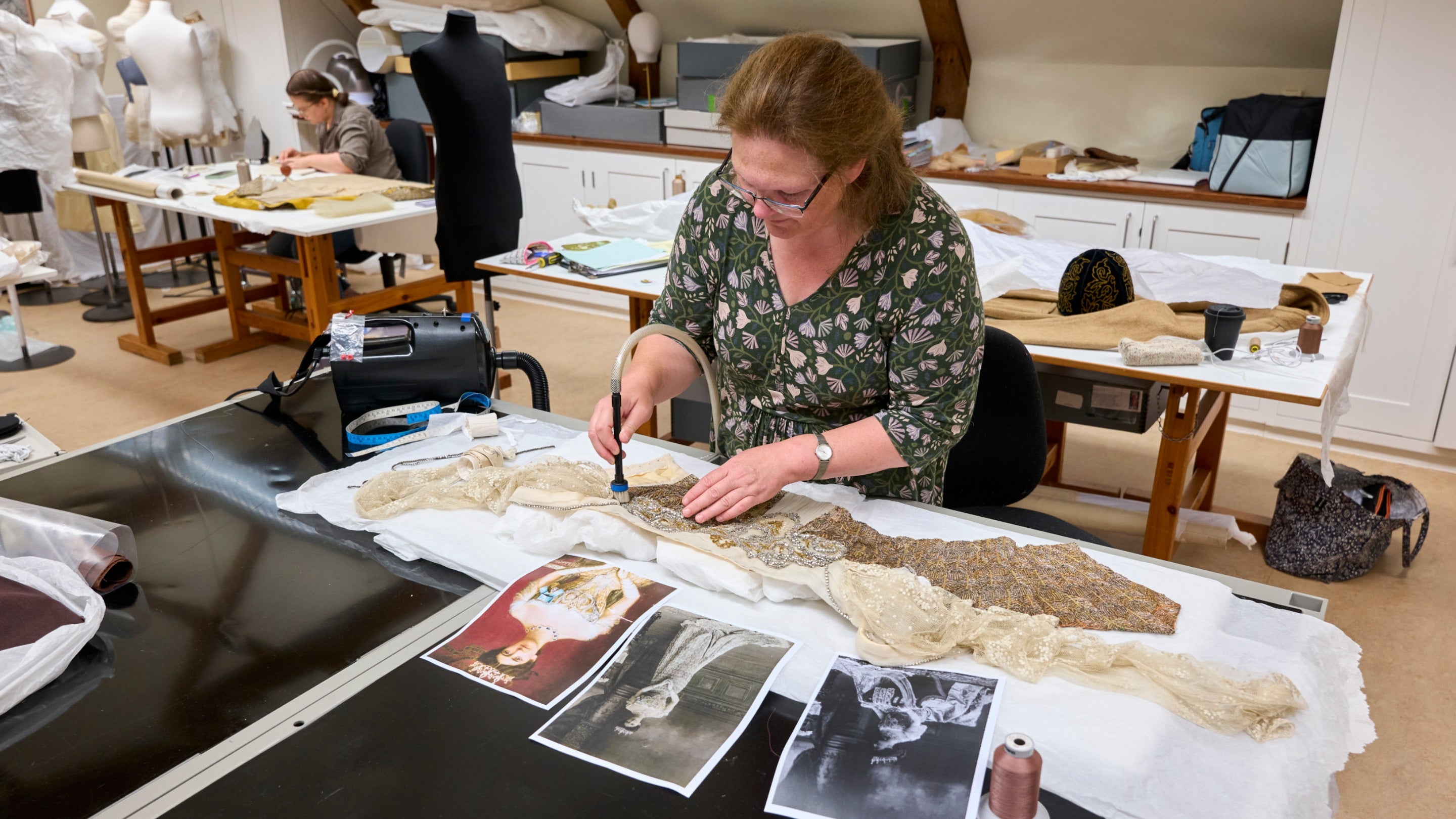 Conservation work on the beaded bodice of the Peacock Dress at the Textile Conservation Studio, Norfolk