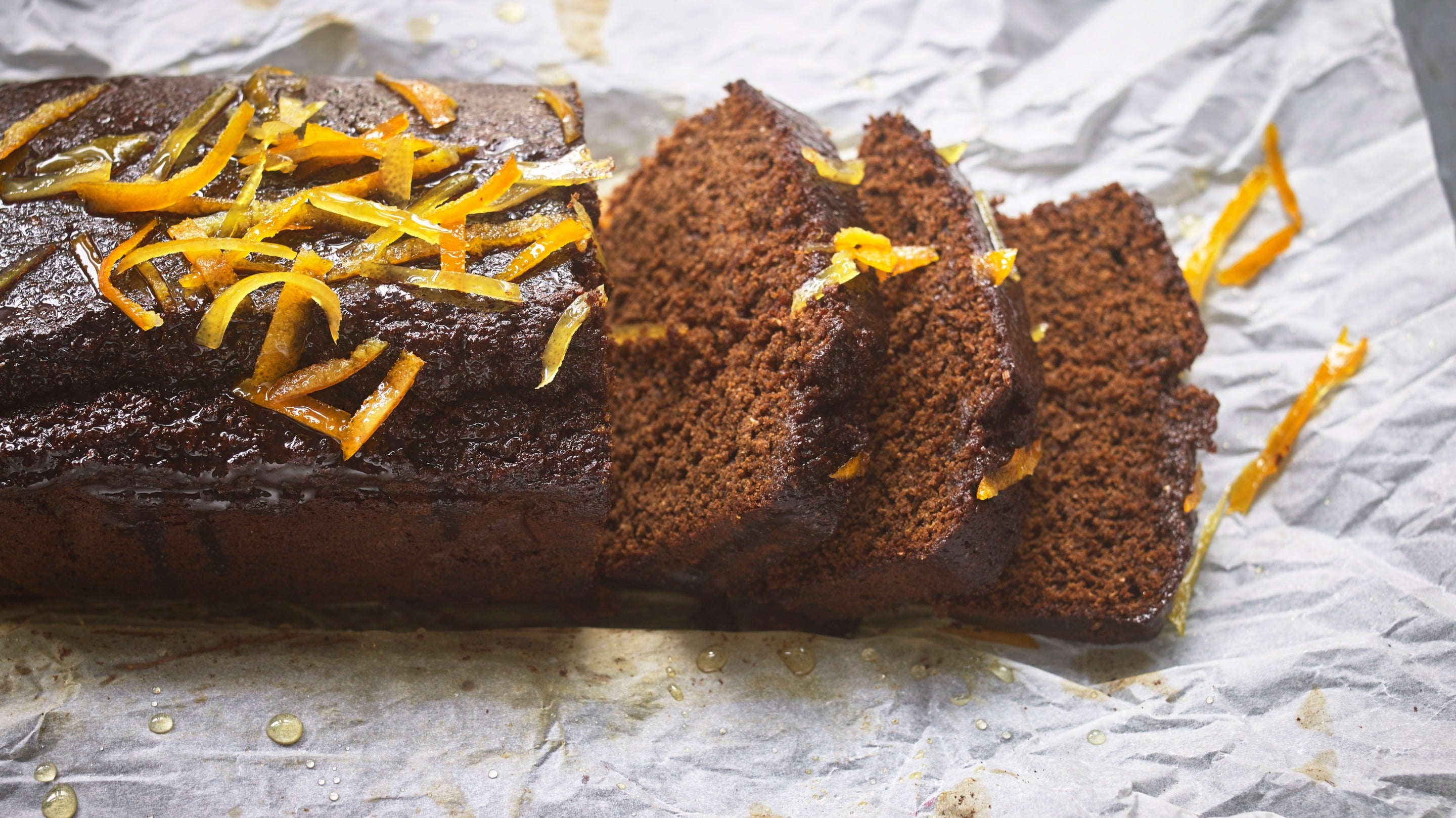 Gingerbread with a sticky glaze and orange peel on the top