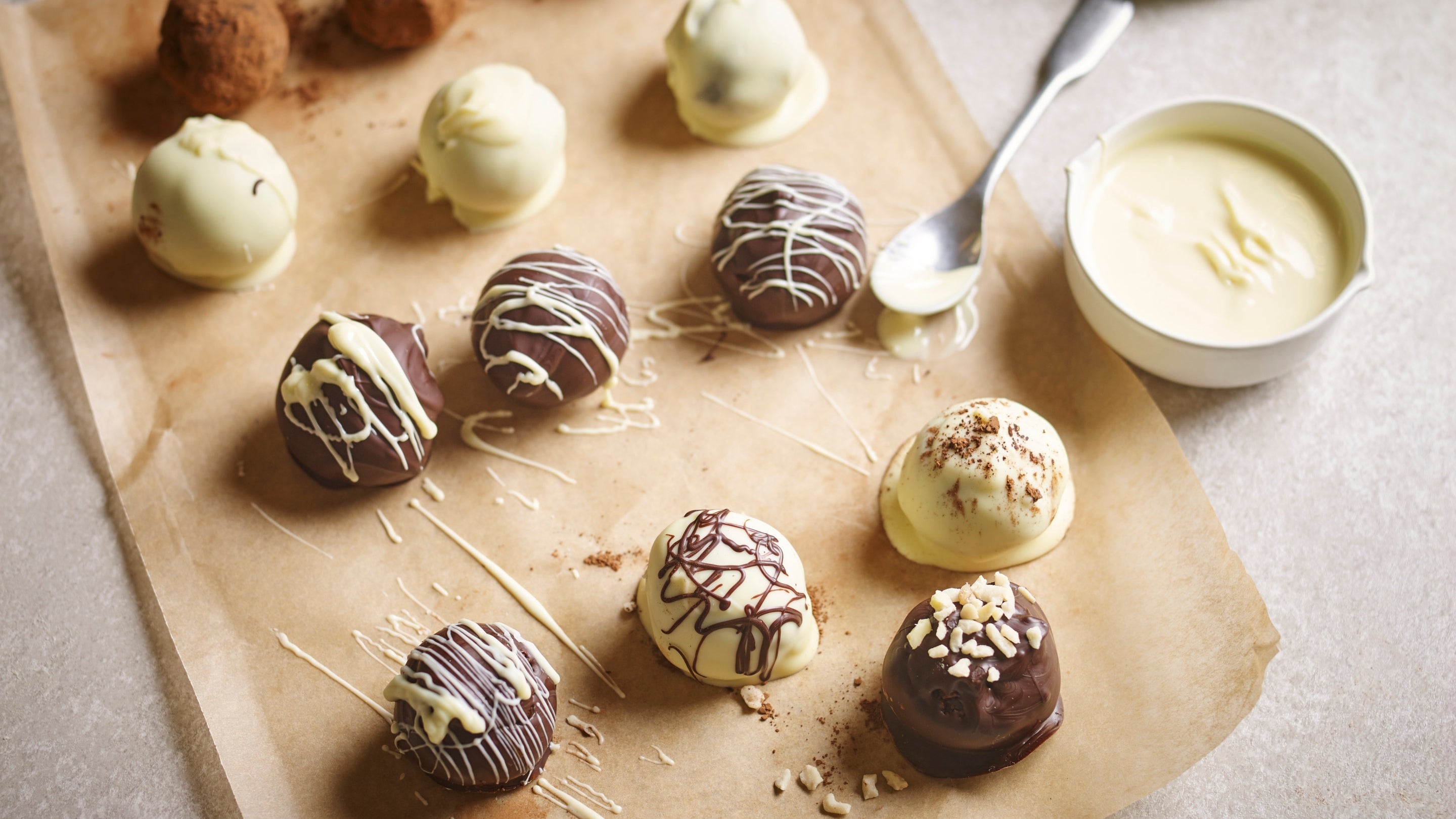 A tray with some decorated chocolate brownie truffle bites
