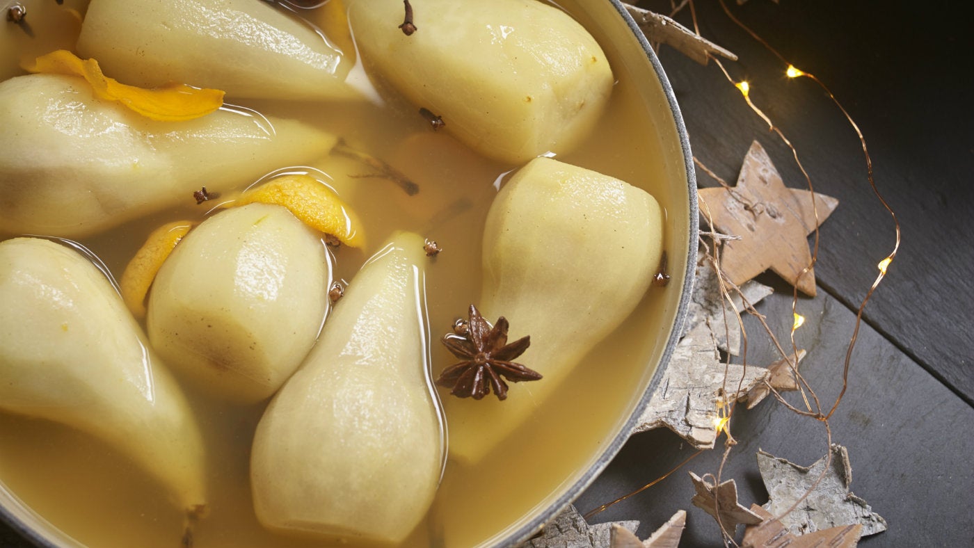 Classic poached pears dessert, with orange and star anise