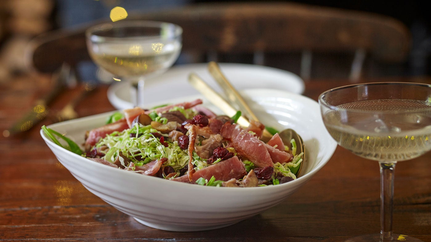Shredded sprout, bacon and chestnut salad in a bowl