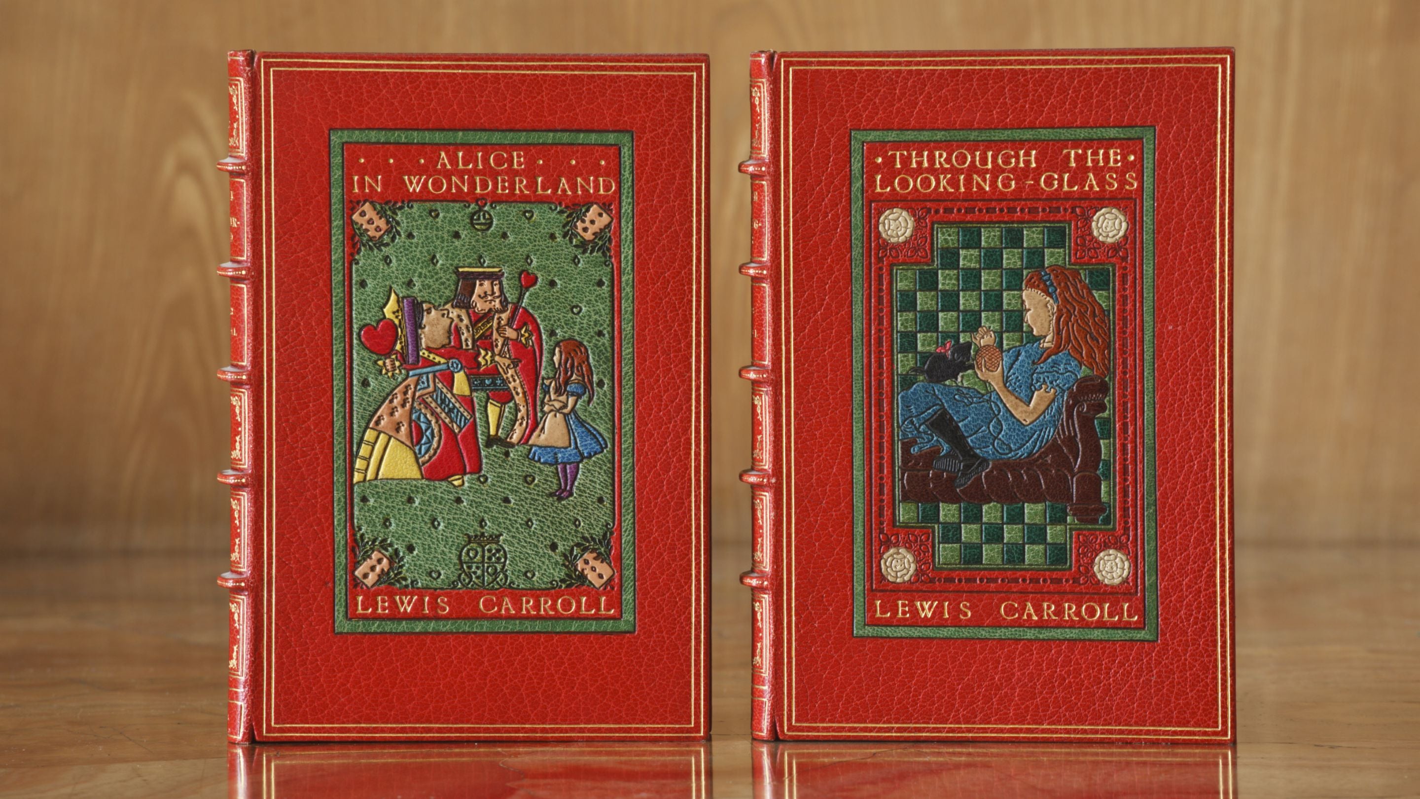 20th-century editions of Lewis Carroll's Alice in Wonderland and Through the Looking Glass, with bindings by Sangorski and Sutcliffe, in the Library at Anglesey Abbey, Cambridgeshire