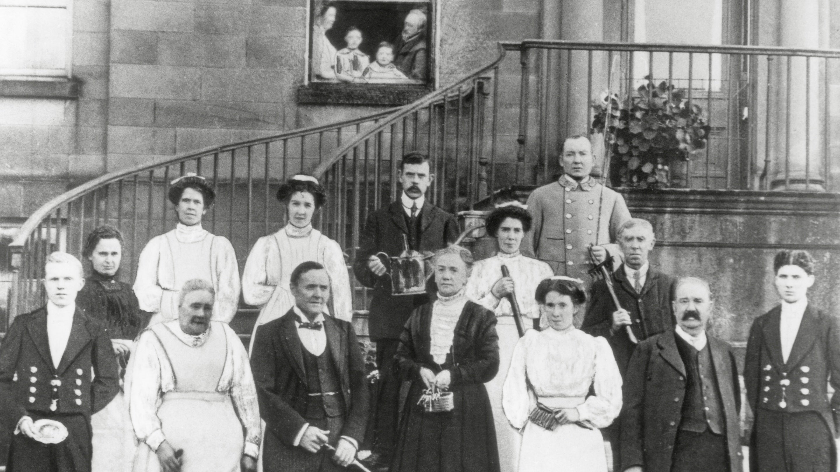 A group portrait of staff in 1912 outside the west front at Erddig, Wrexham
