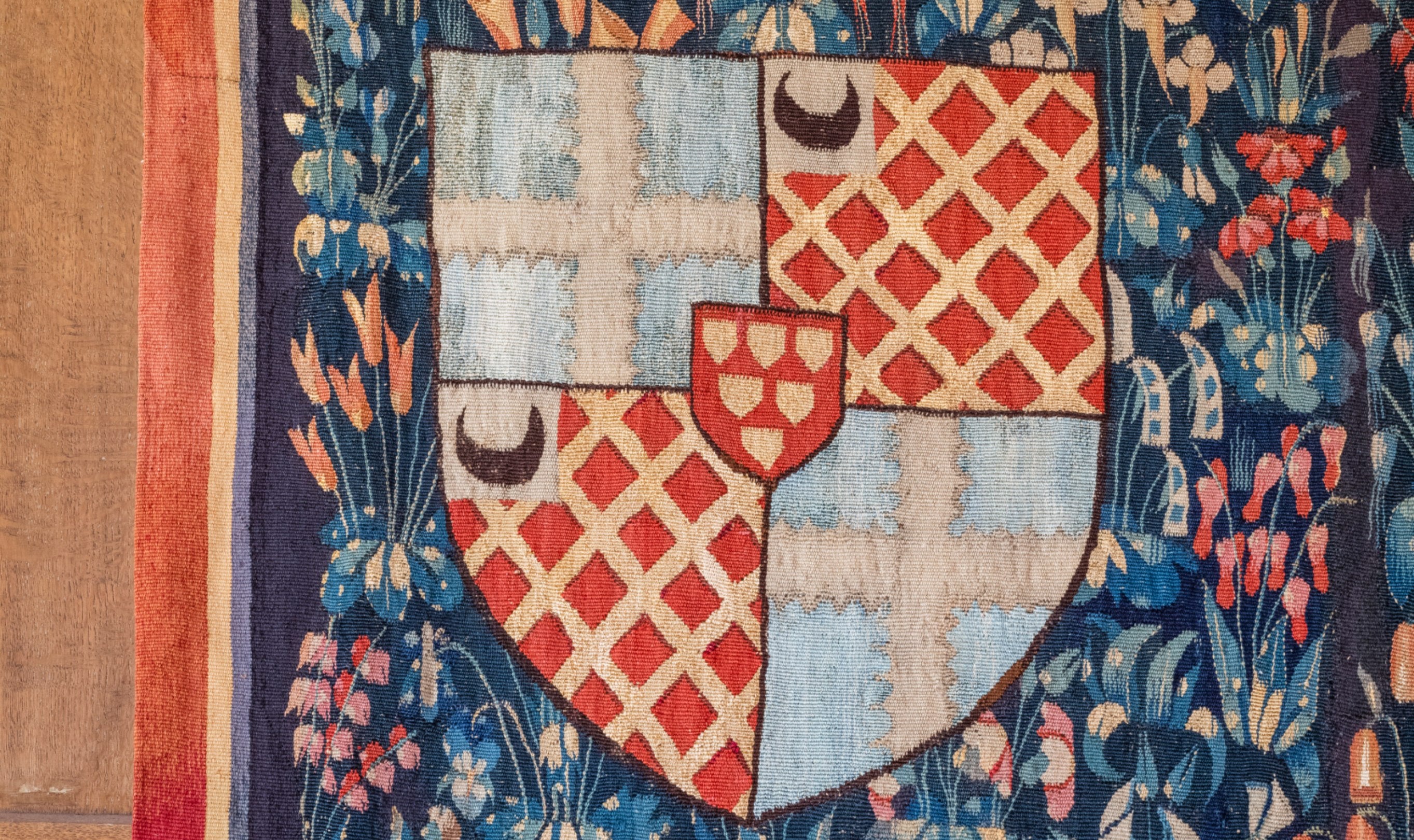 Close up detail of Knight with the Arms of Jean de Daillon Tapestry at Montacute House.