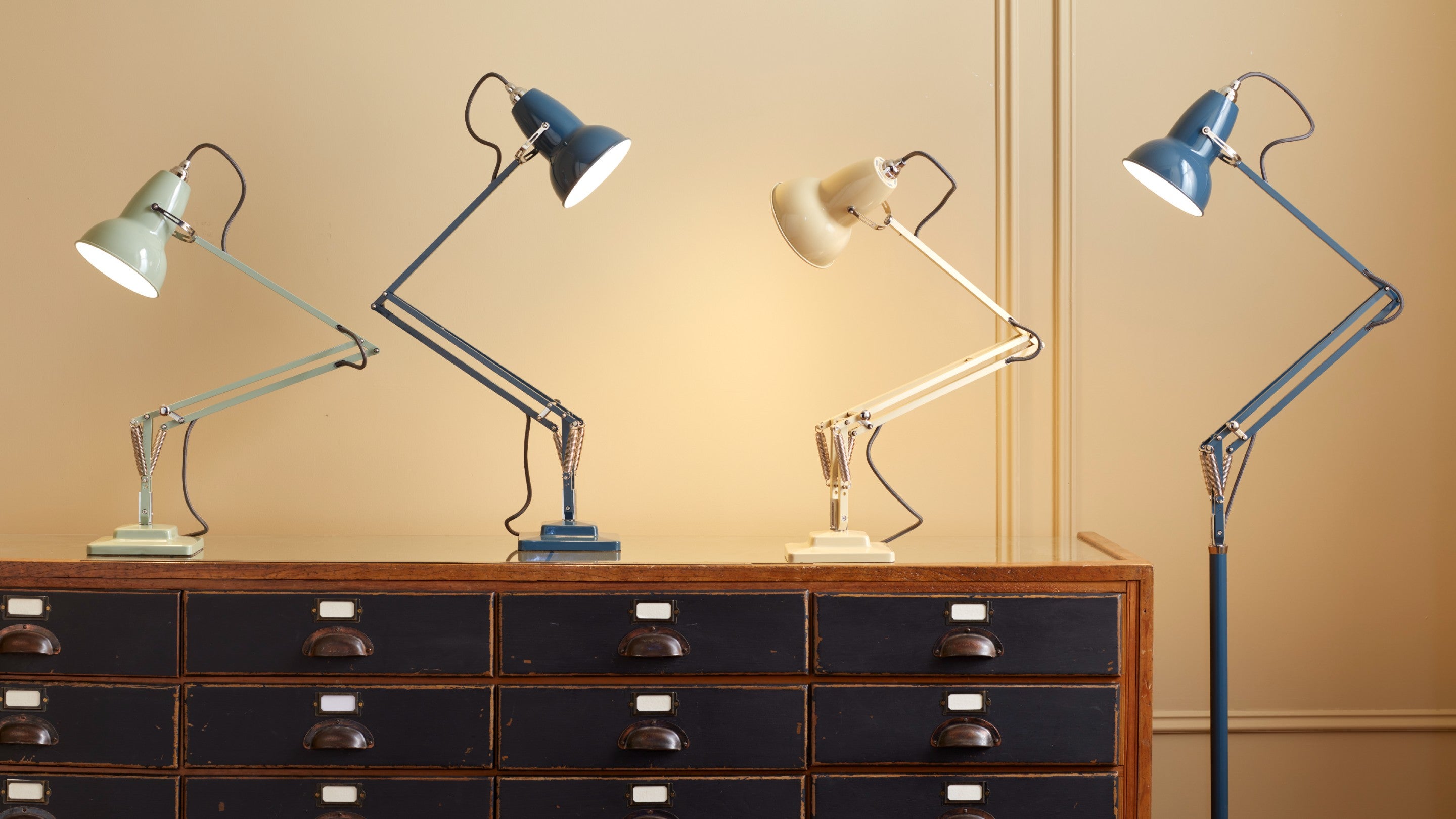Anglepoise lamps on a counter