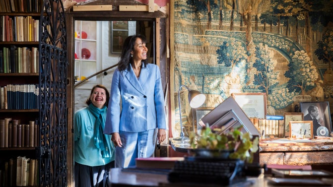 Two ladies exploring the interior of a room at Sissinghurst Castle Garden