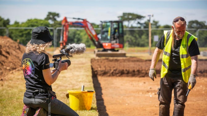 Time Team filming in a trench during a dig at Sutton Hoo, Suffolk
