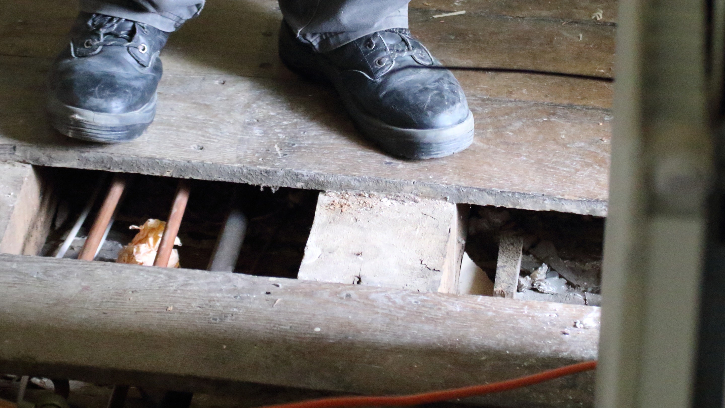 View of the floorboards taken up and wiring exposed for the re-wiring project, Baddesley Clinton, Warwickshire
