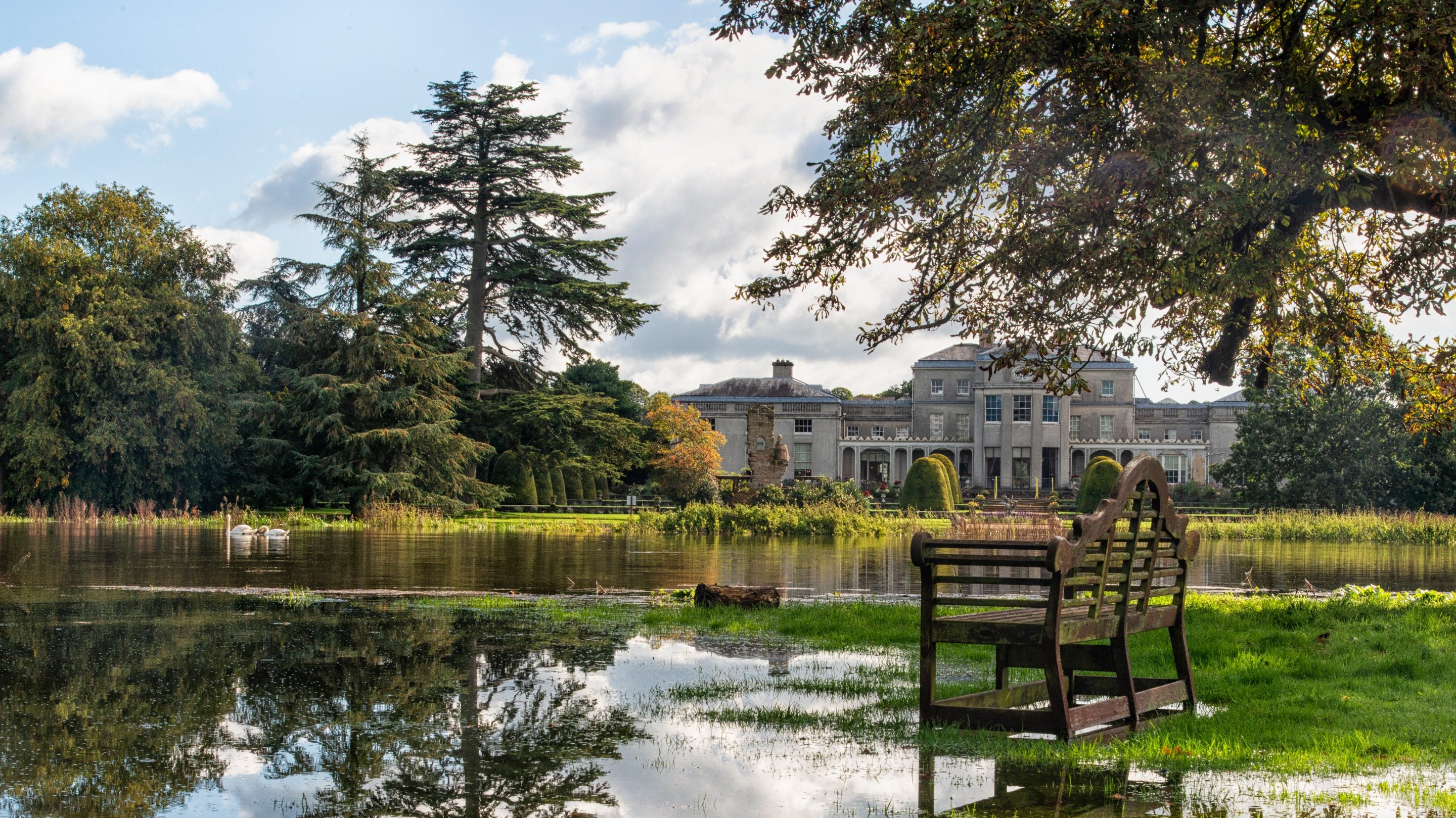 The rear garden under flood water in autumn at Shugborough Estate, Staffordshire