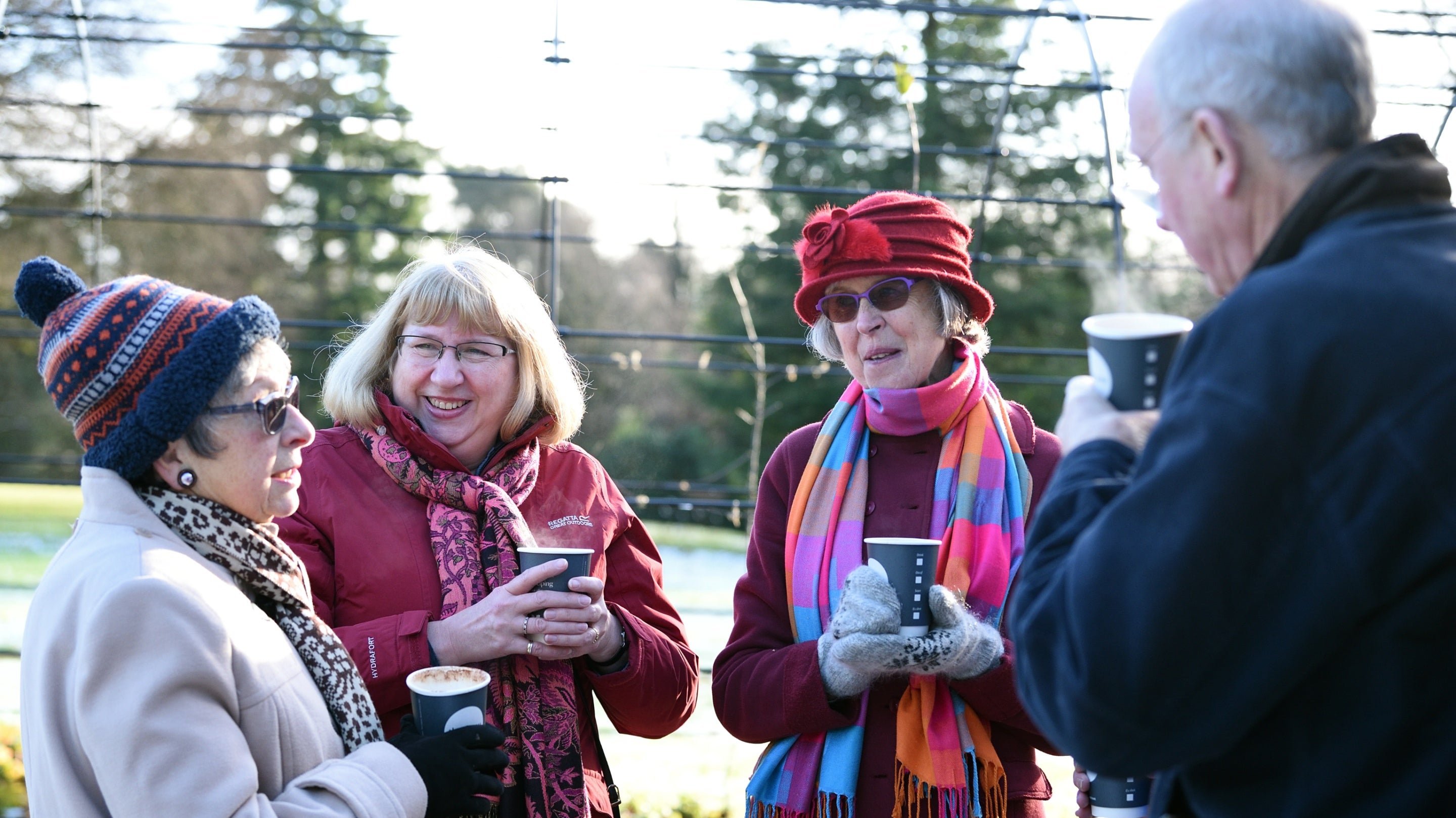 Visitors enjoying a hot drink on a winters' day at Quarry Bank Mill, Cheshire