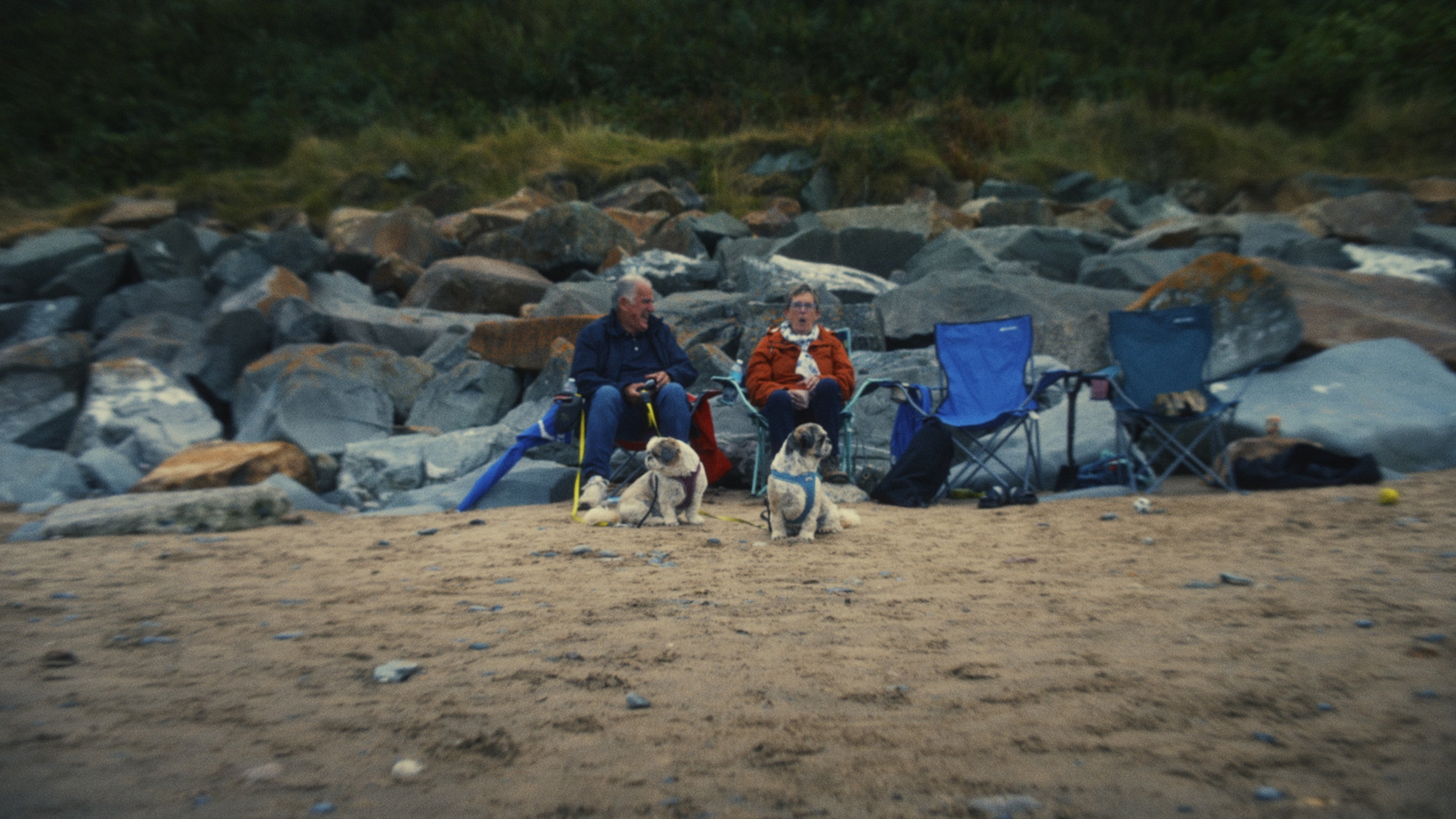 A couple on Porthdinllaen Beach, Gwynedd, in a National Trust advert about gifts in wills