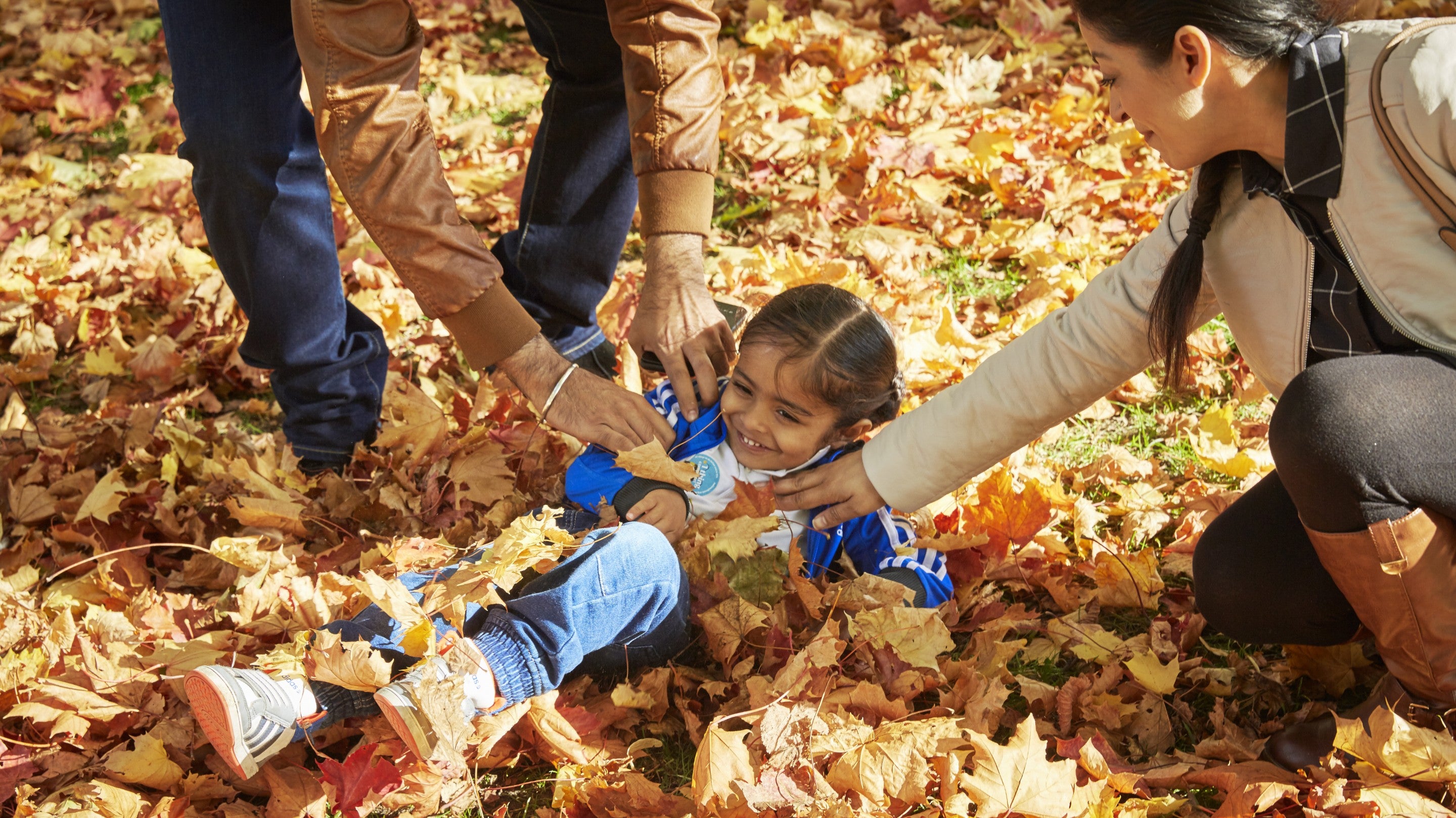 A family in the garden in October at Ham House and Garden, Surrey
