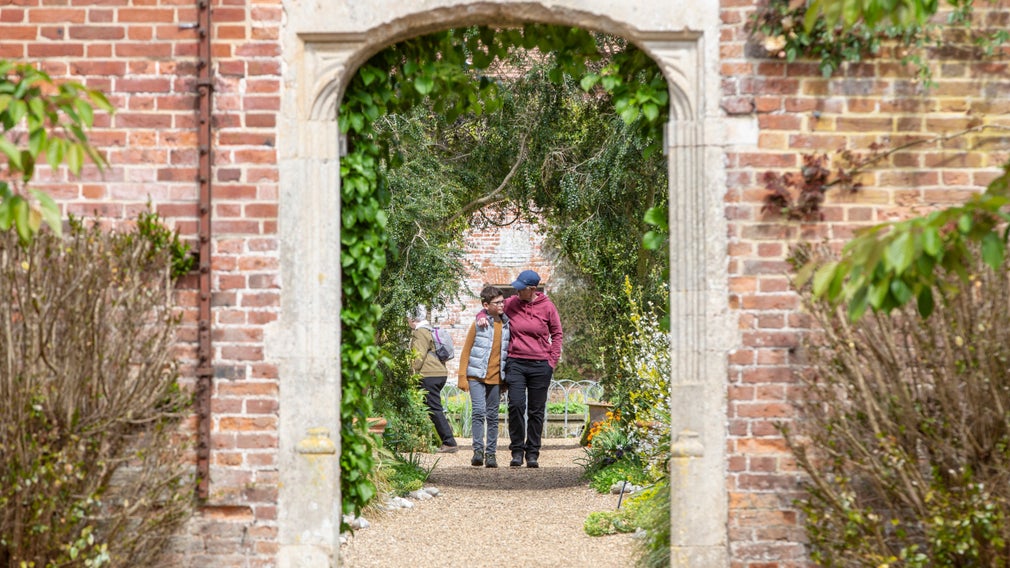 Family exploring the Walled Garden at Felbrigg Hall, Gardens and Estate, Norfolk