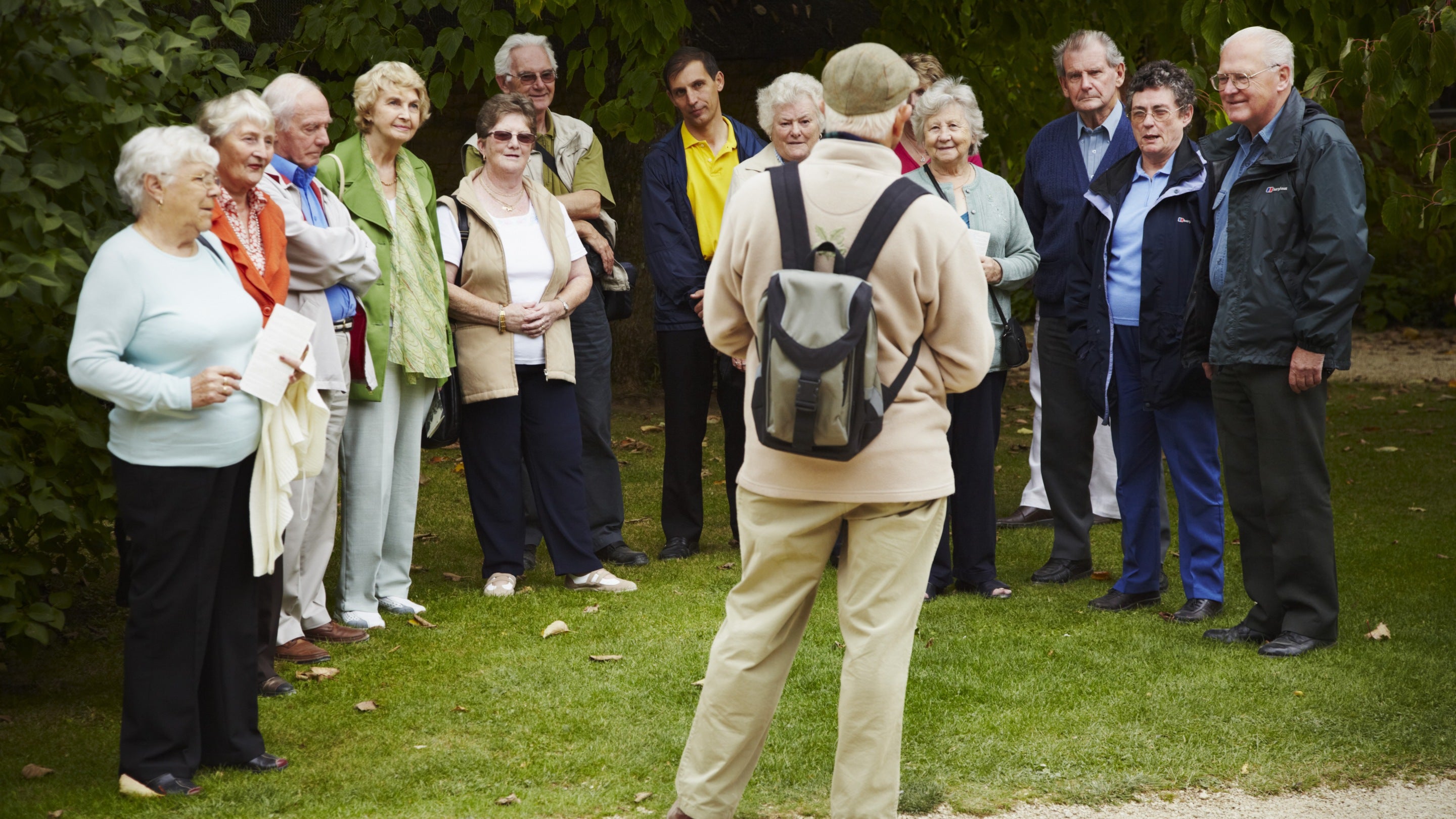 Visitors on a guided group tour with a volunteer guide at Hidcote Manor Garden, Gloucestershire in September
