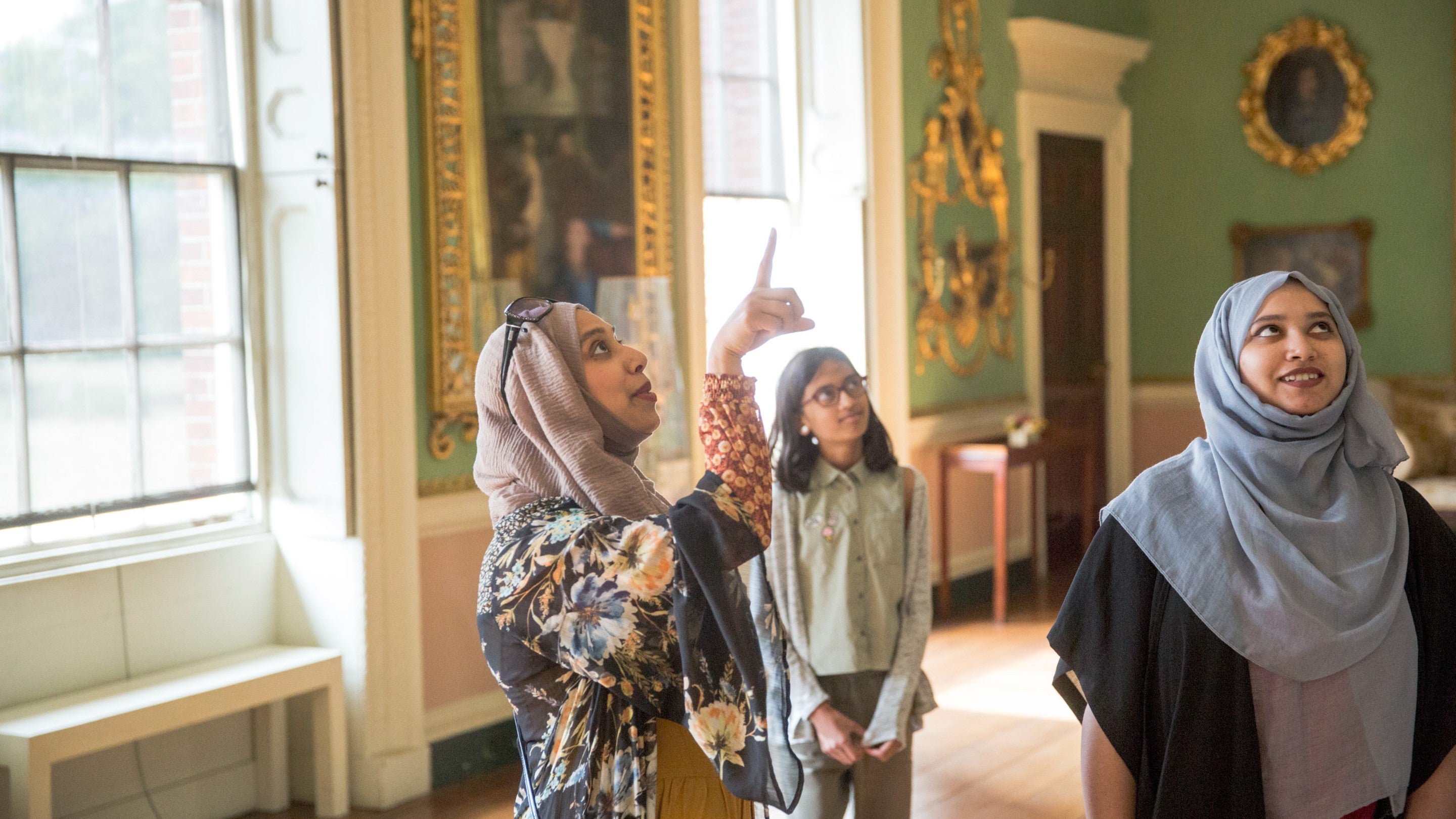Three visitors in the Long Gallery at Osterley Park and House, London