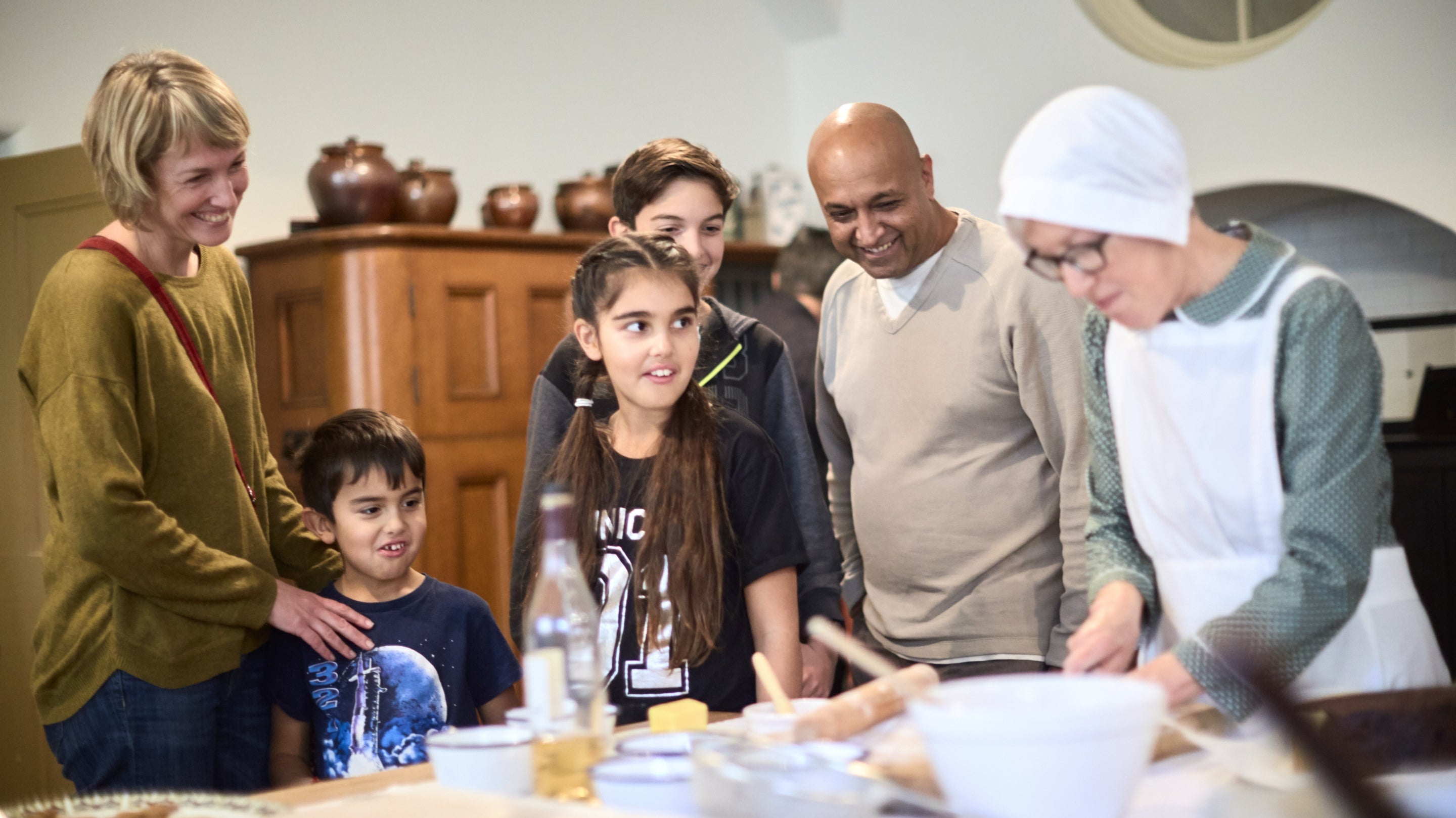 Visitors and costumed interpreter in the kitchen at Ickworth, Suffolk