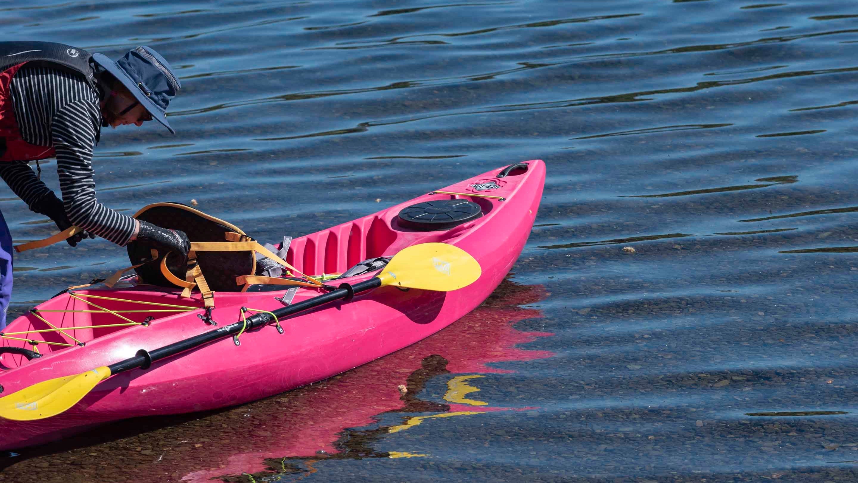 Person preparing their canoe on Windermere at Low Wray Campsite, Lake District