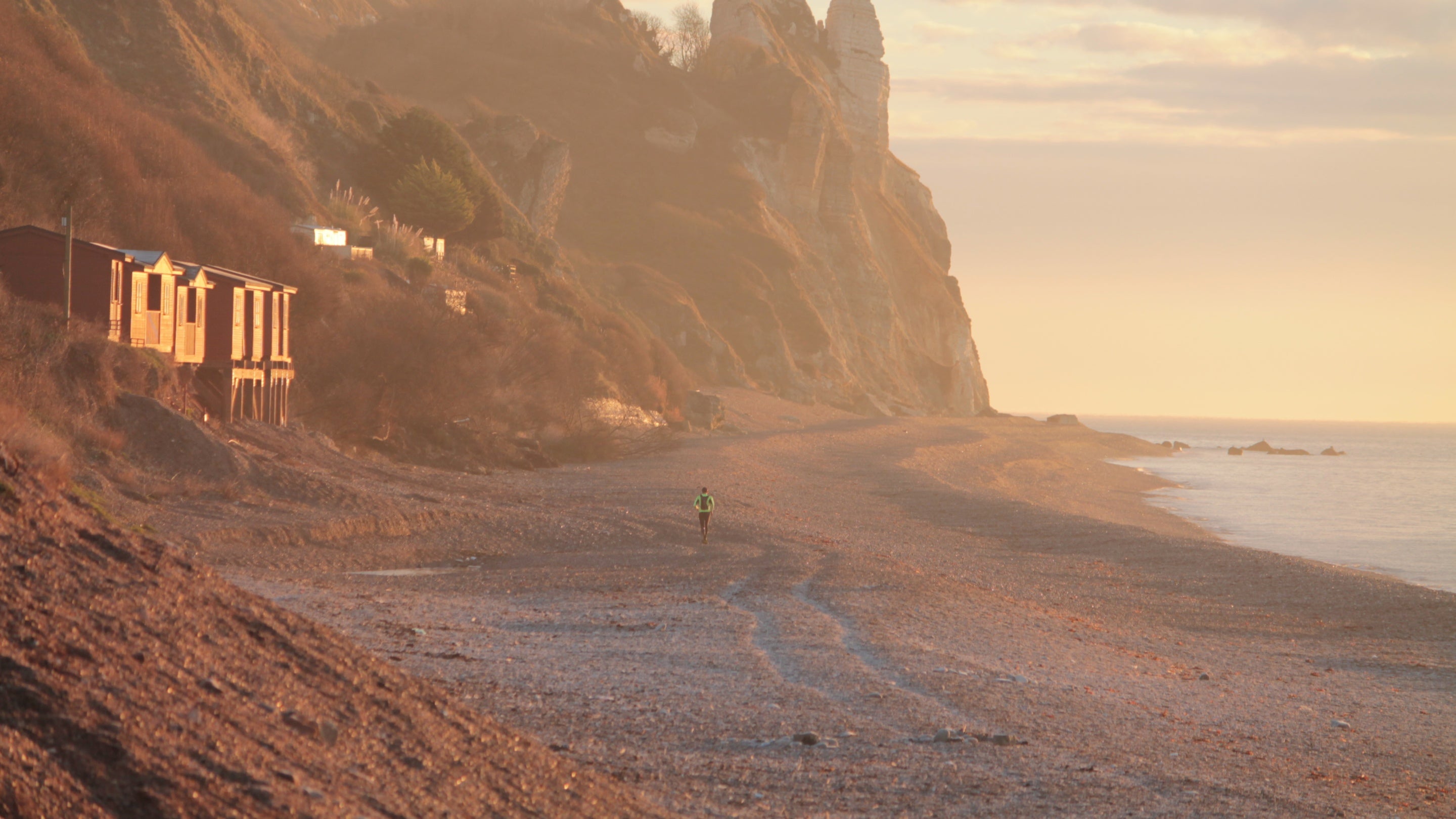 Jogger on Branscombe Beach, Devon