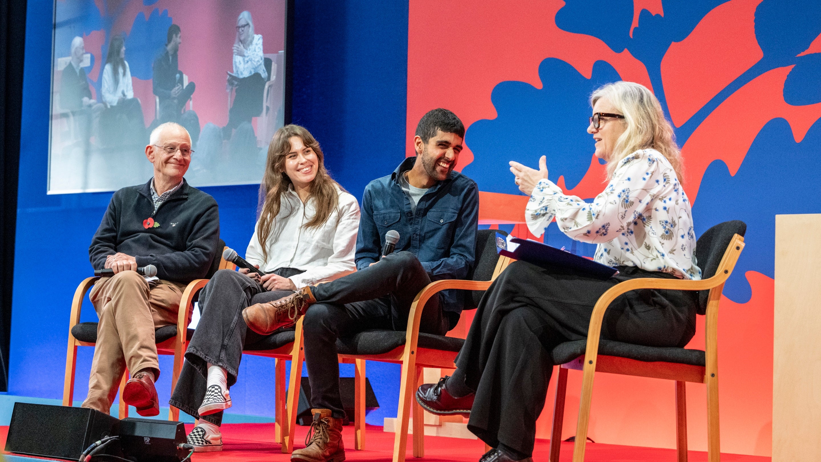 People talking on stage during the AGM 2025
