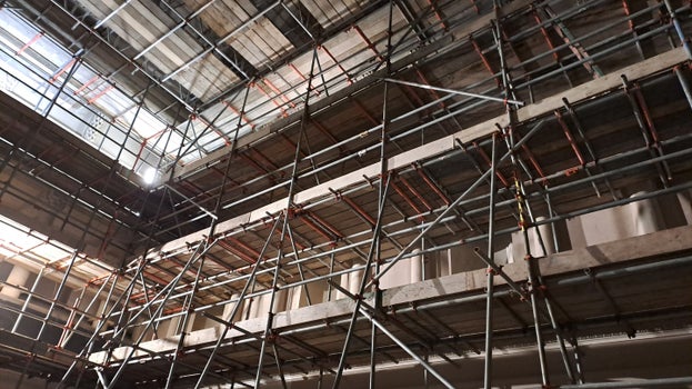 A view looking up in the Tea Room showing two sides of the room and part of the ceiling completely covered in scaffolding.