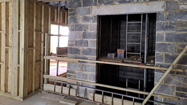 Brickwork of the lift shaft now on the second floor (4th floor of the building) and having reached ceiling height.