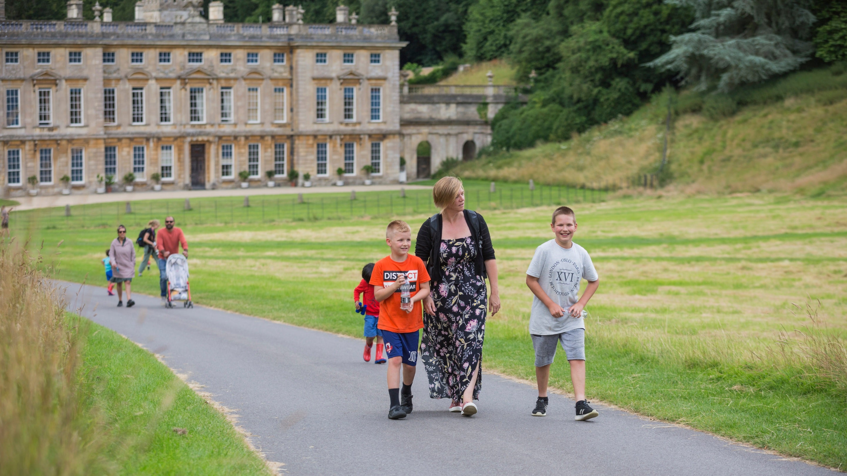 Visitors walking on the main drive at Dyrham Park, South Gloucestershire