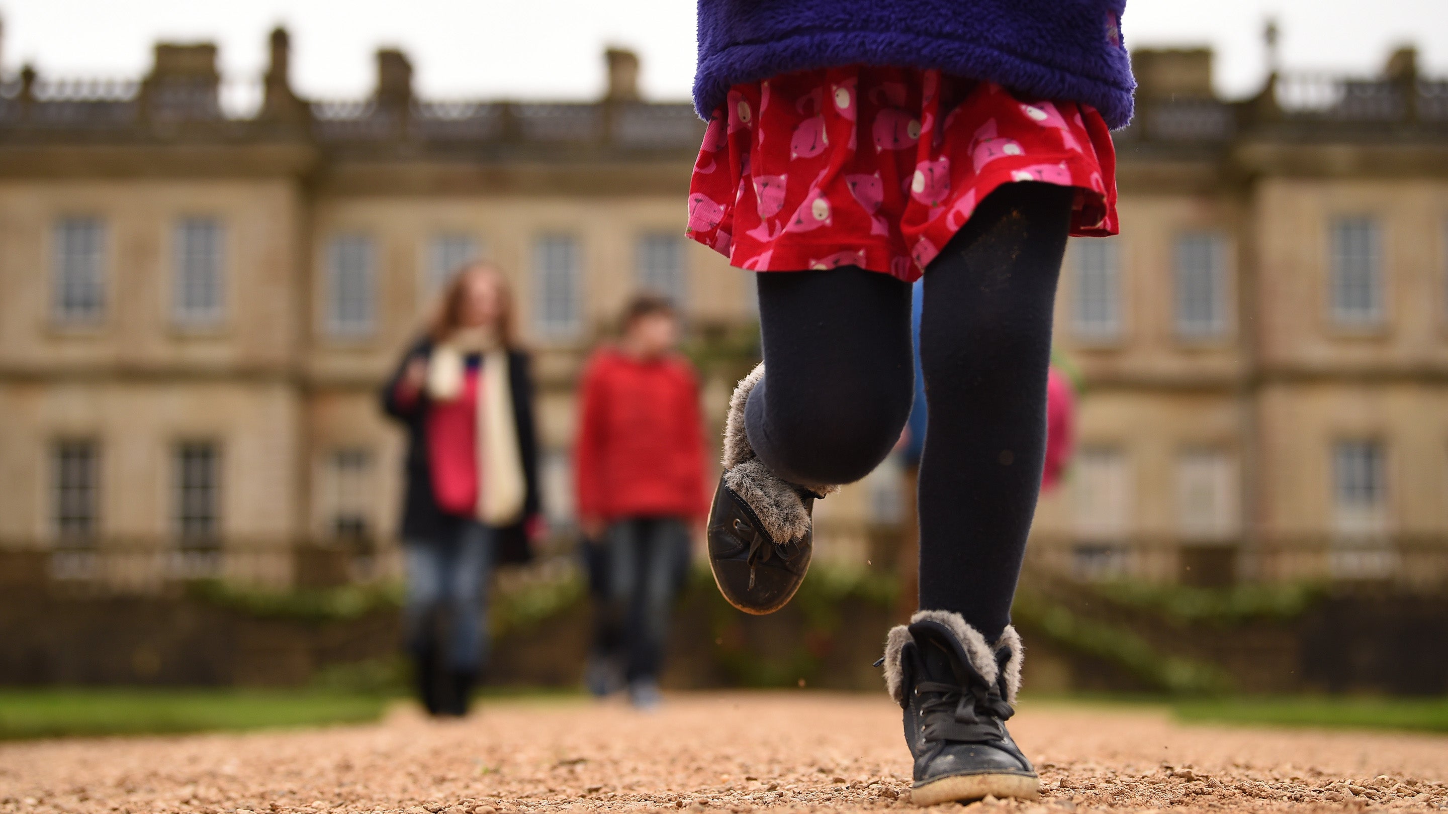 Visitors on a winter trail through the parkland at Dyrham Park