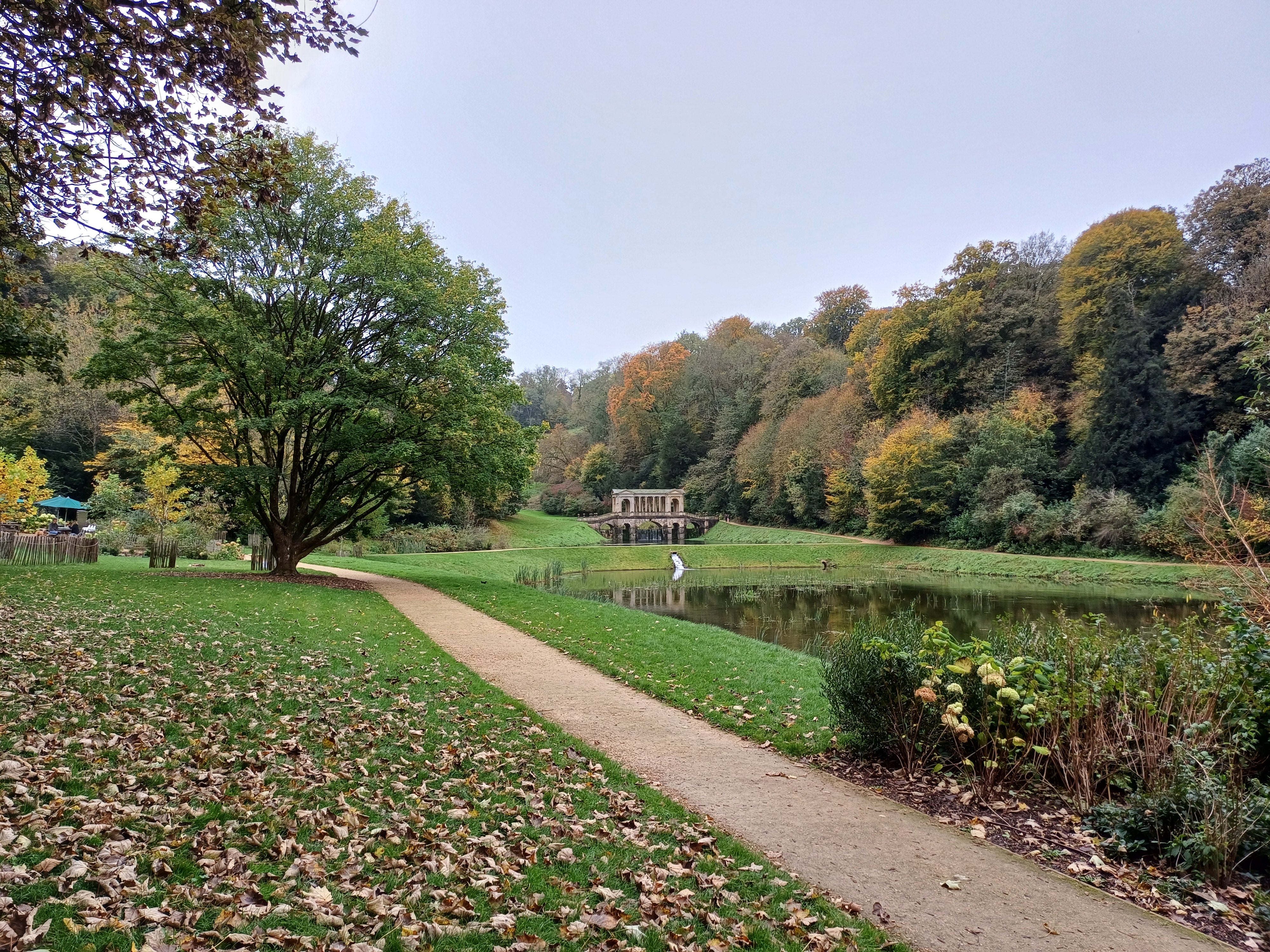 Prior Park near lower entrance in autumn with view of Palladian bridge
