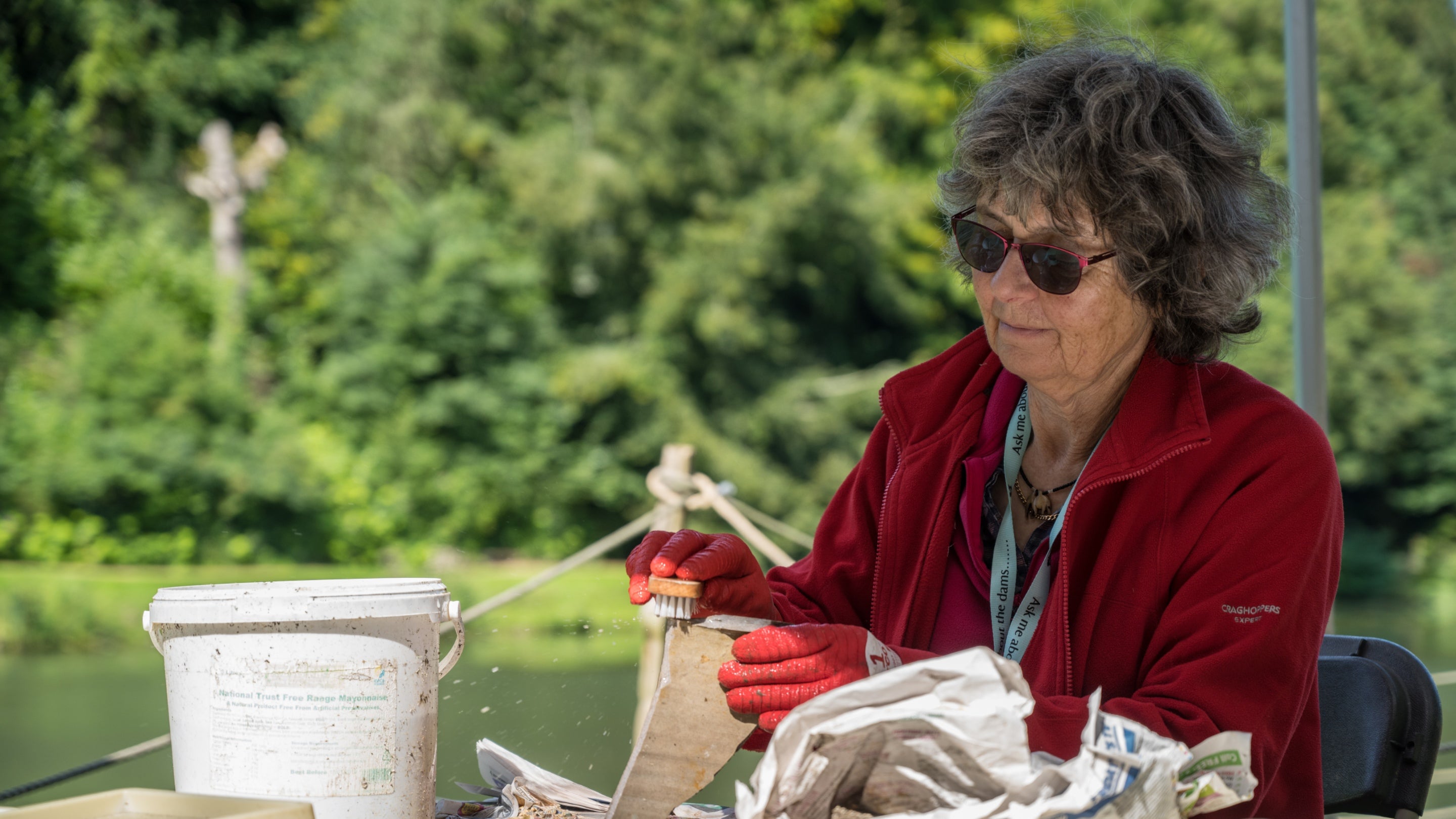 Archaeology volunteer cleaning findings at Prior Park, Bath