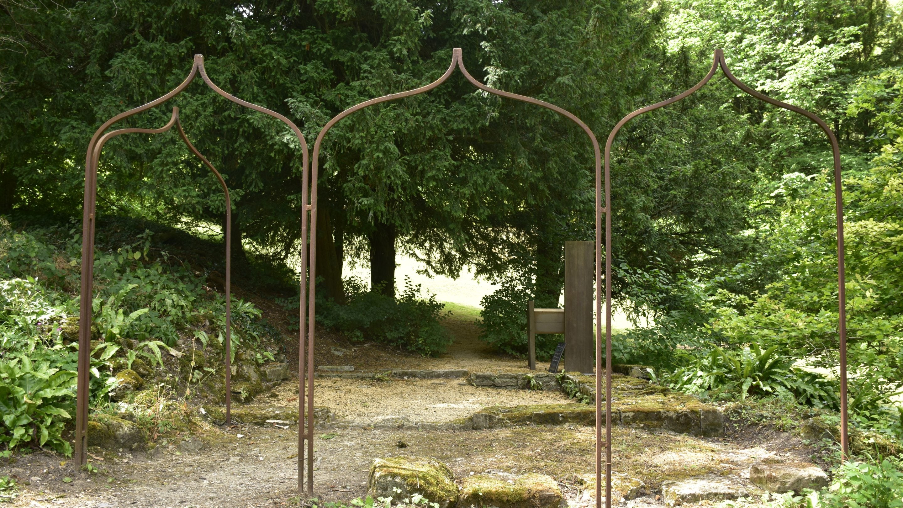 A metal frame that outlines the shape of the Gothic Temple that once stood in this location
