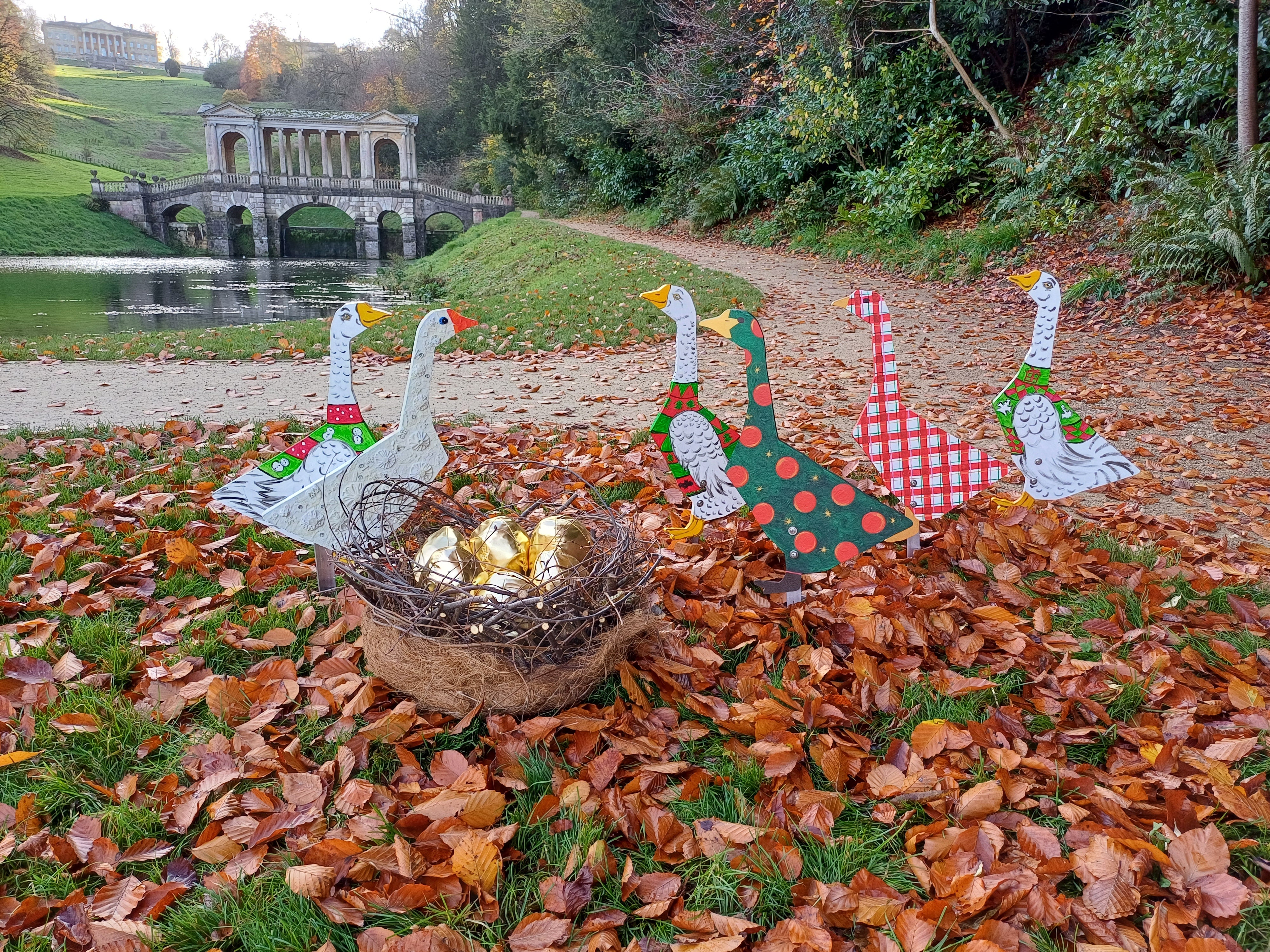 Six geese-a-laying in front of the Palladian bridge at Prior Park, for the 12 Days of Christmas trail at Prior Park