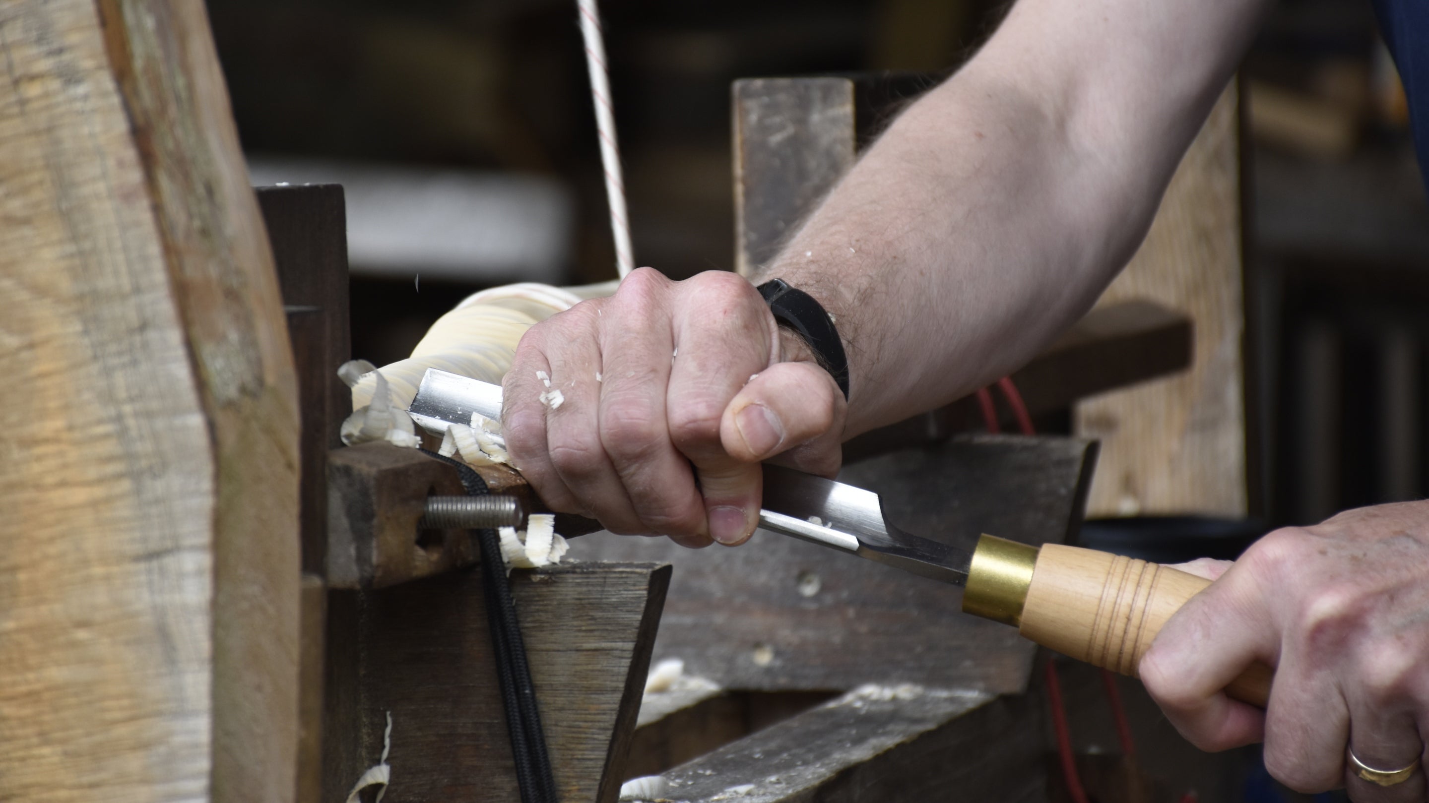 Wood worker using a pole lathe at Tyntesfield, Bristol