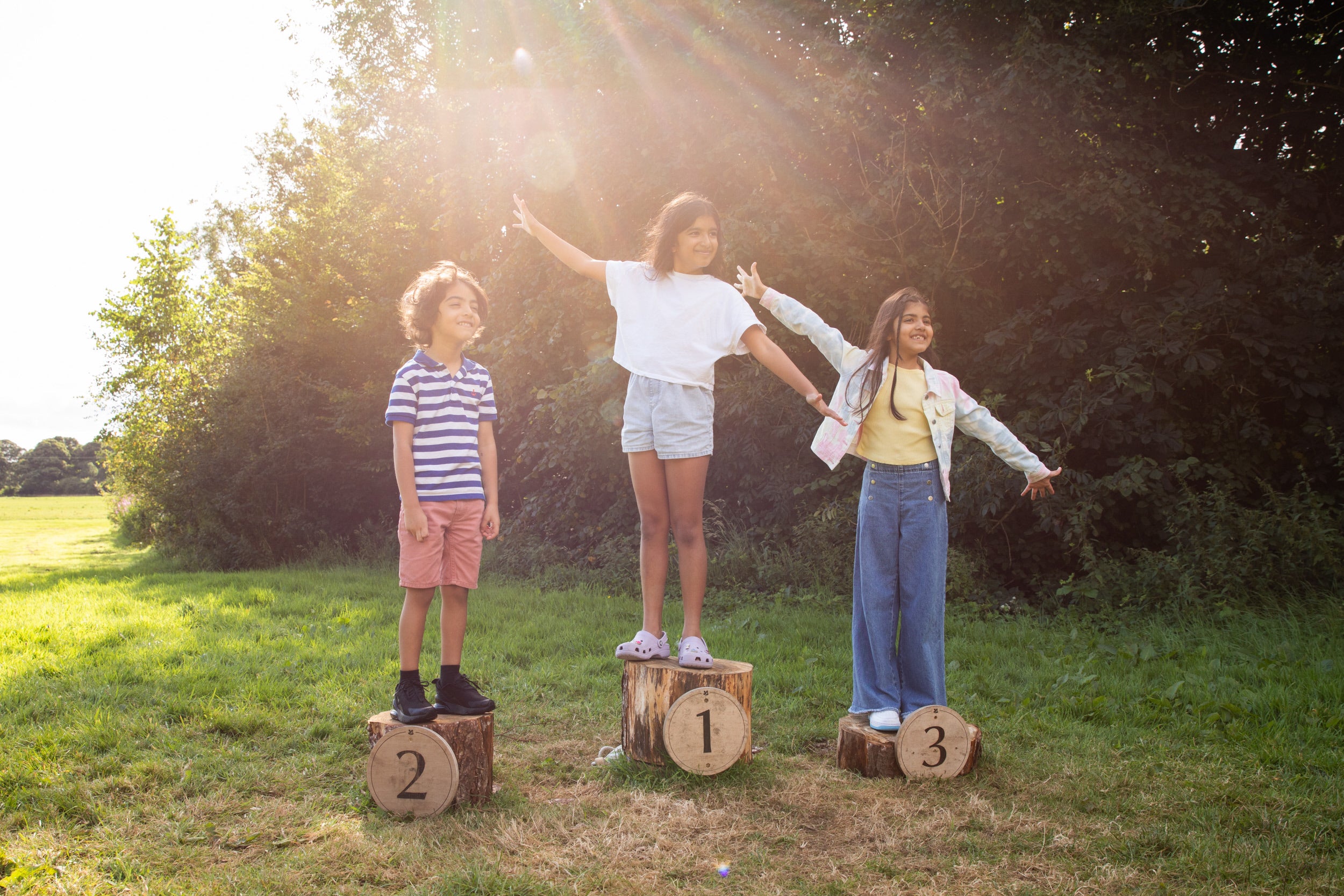 Three children enjoying a Summer of Play at Seaton Delaval Hall, Northumberland