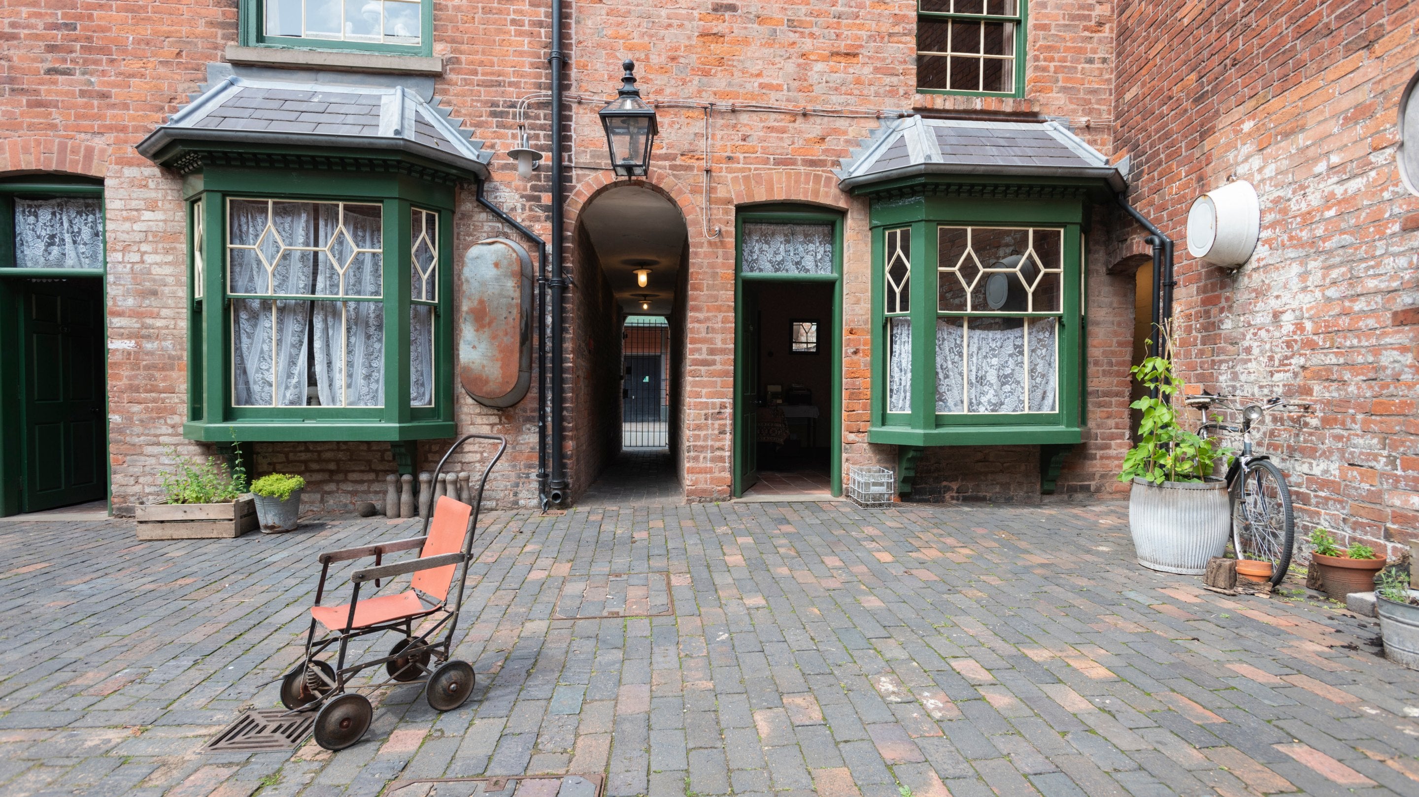 The Courtyard of Court 15, Birmingham Back to Backs with a chair on the courtyard