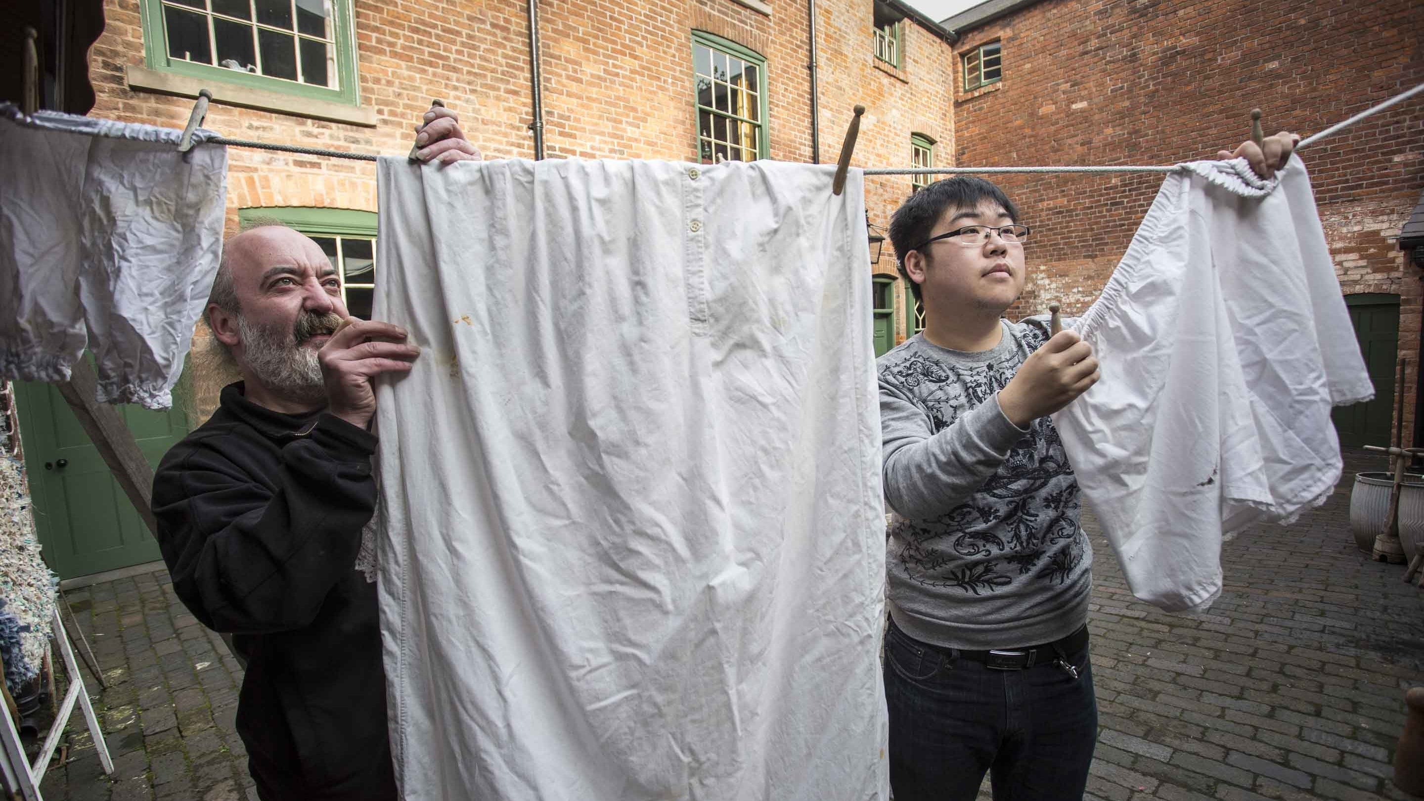 Young volunteers and guests, Birmingham Back to Backs, summer 2016. On a fascinating guided tour, visitors step back in time at Birmingham's last surviving court of back to backs; houses built literally back-to-back around a communal courtyard.