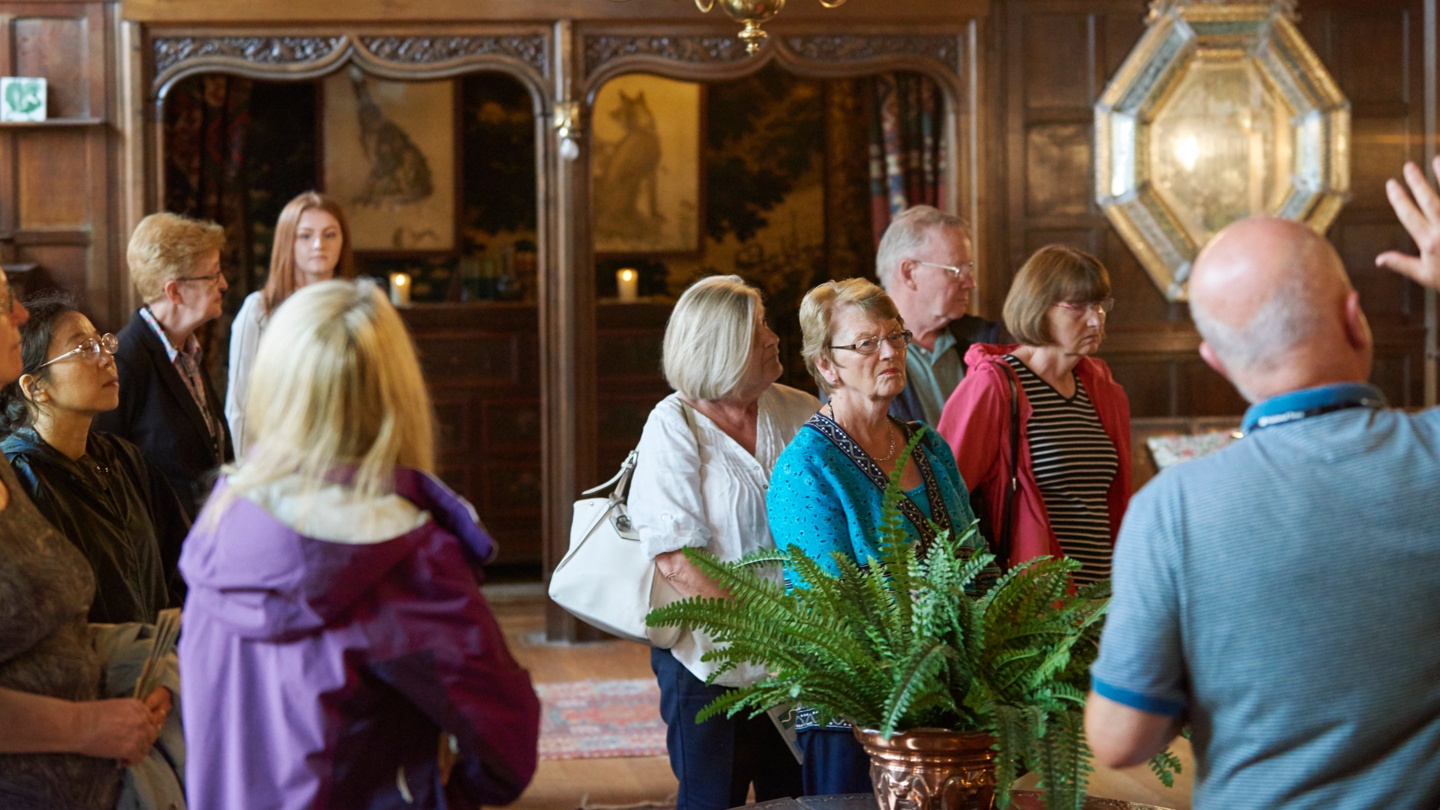 Visitors enjoying a tour of Wightwick Manor, West Midlands