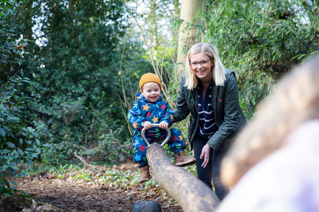 Children playing in the natural woodland play area at Wightwick Manor and Gardens, West Midlands