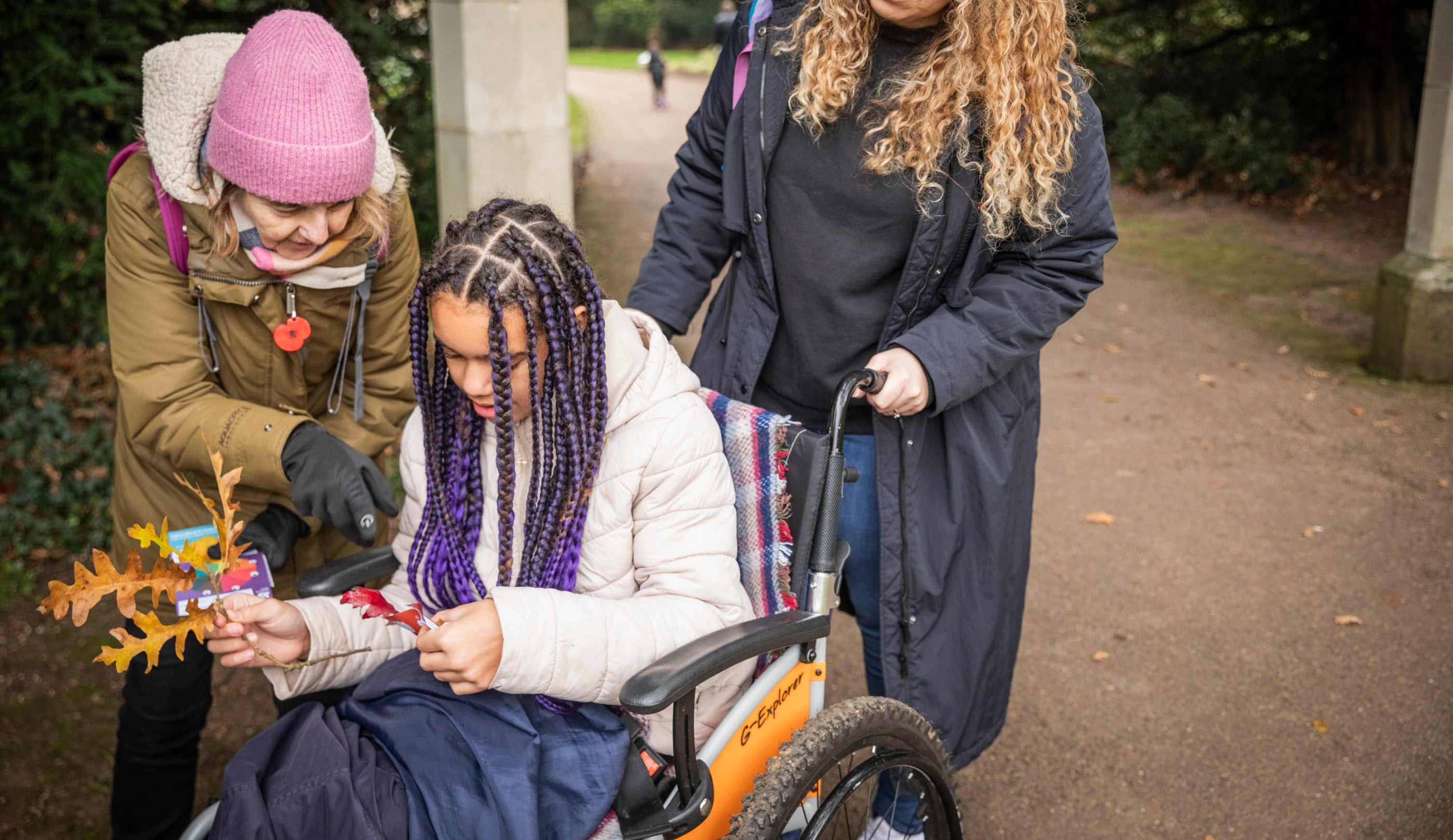 Family exploring the Halloween trail in the park at Anglesey Abbey, Gardens and Lode Mill, Cambridgeshire