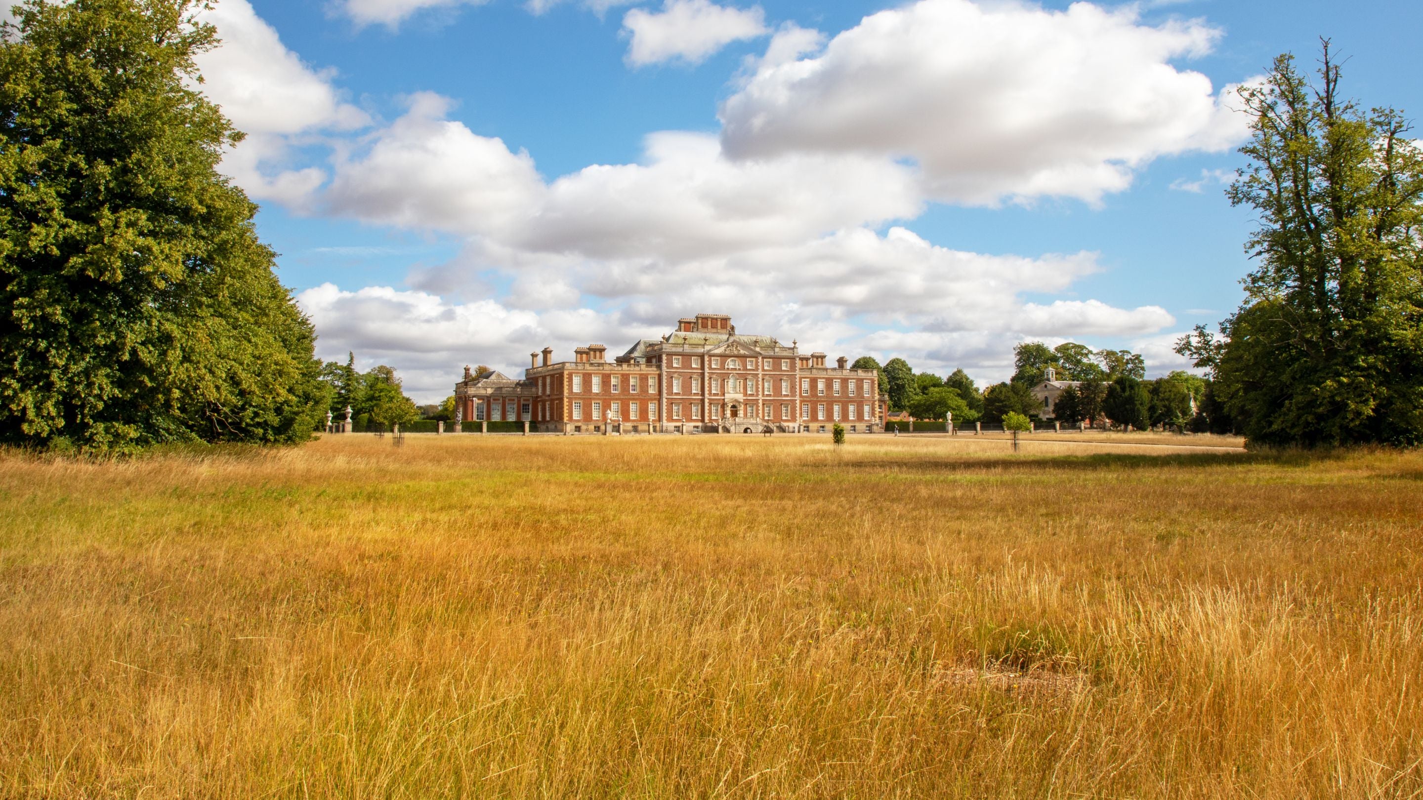 Wimpole hall with parched brown grass in front