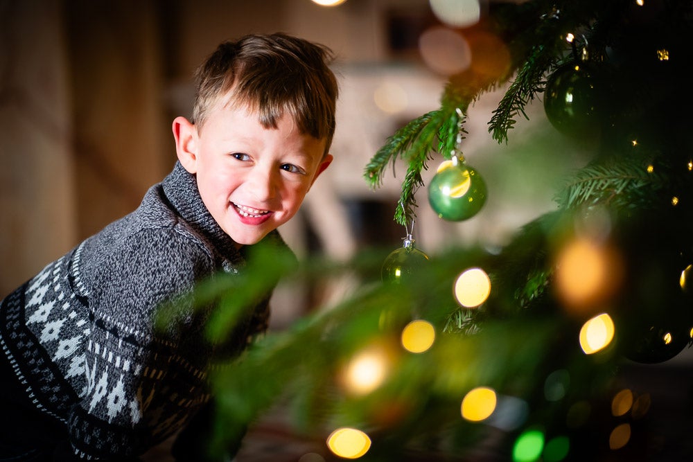 A young visitor enjoying Christmas in Wimpole Hall, Cambridgeshire