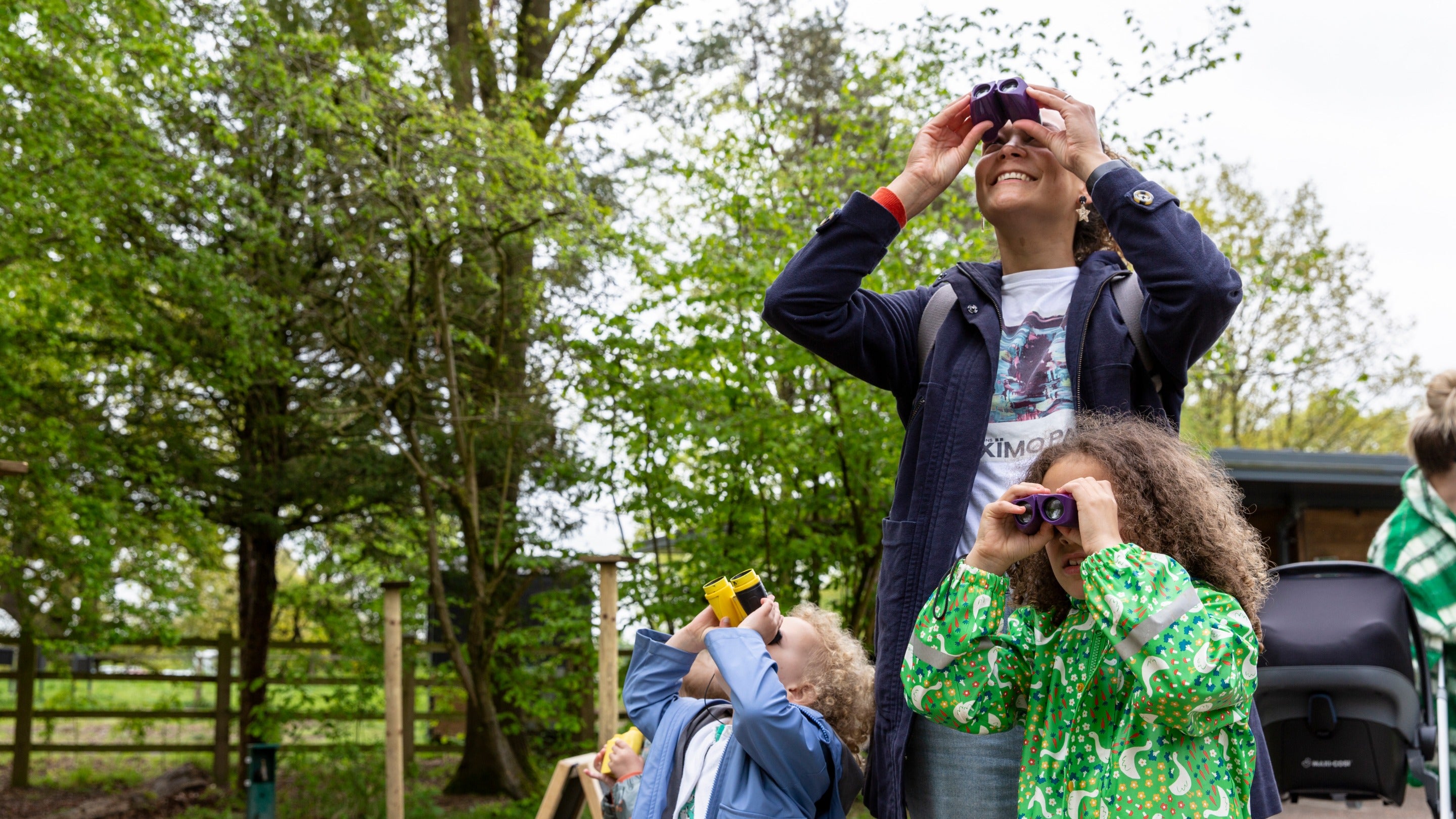 Looking through binoculars at Quarry Bank, Cheshire