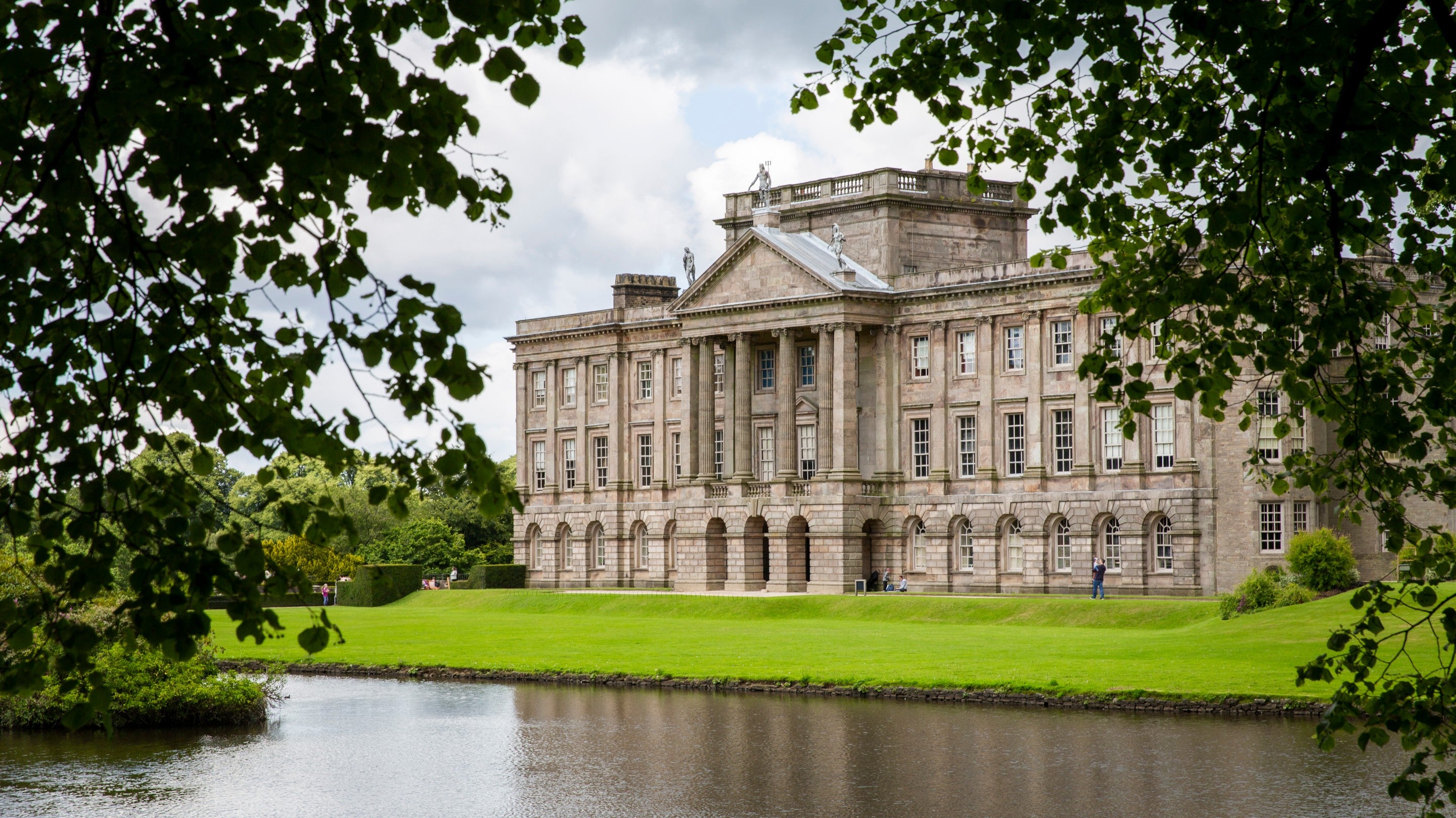 View of the South Front of the house over the lake at Lyme Park, Cheshire